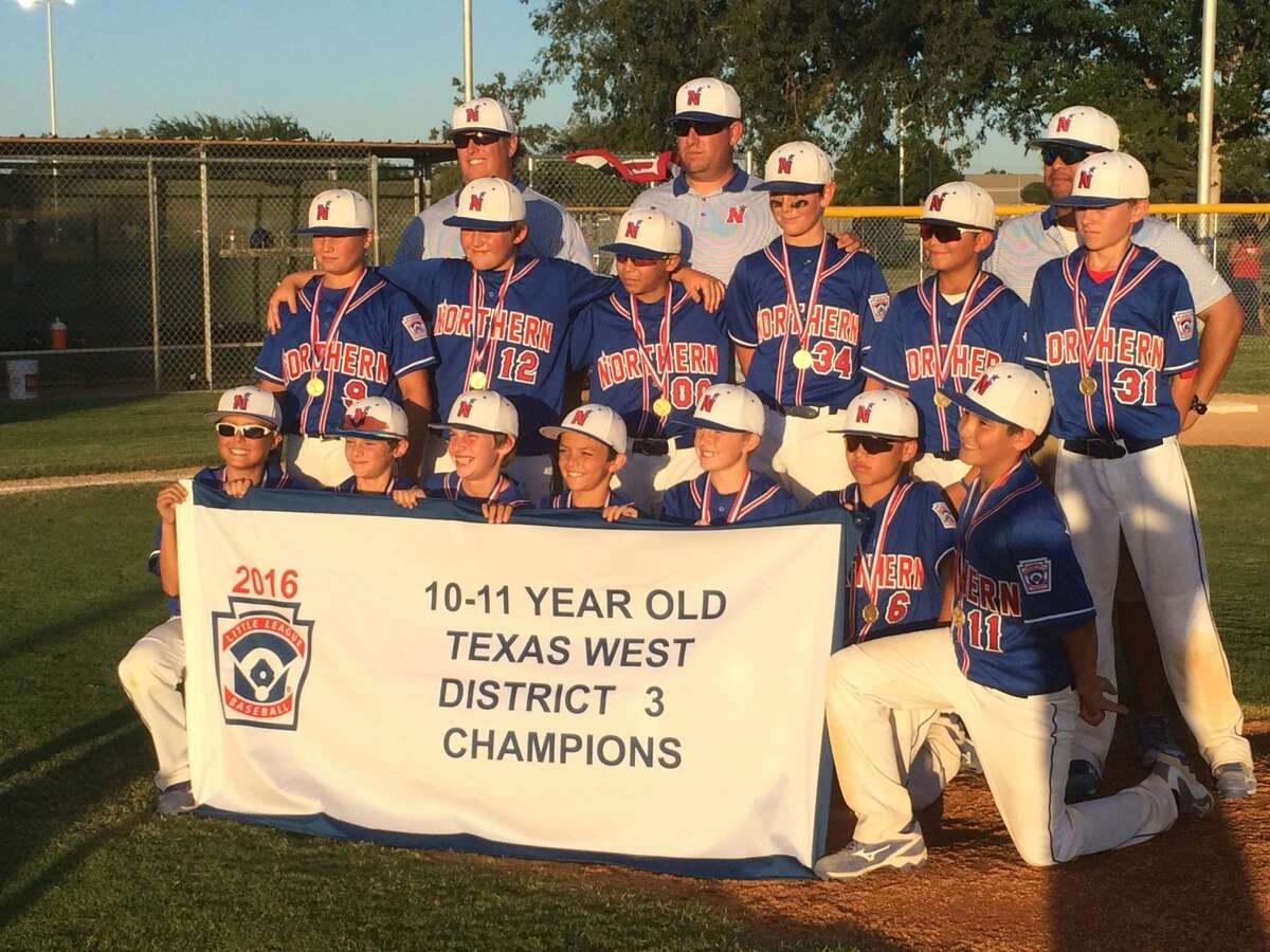 The Northern All-Stars hold up their 10-11 year old District 3 championship banner. Northern defeated Mid City 12-0 in the championship game at Butler Park on Thursday night. Photo by Will Korn|Reporter-Telegram