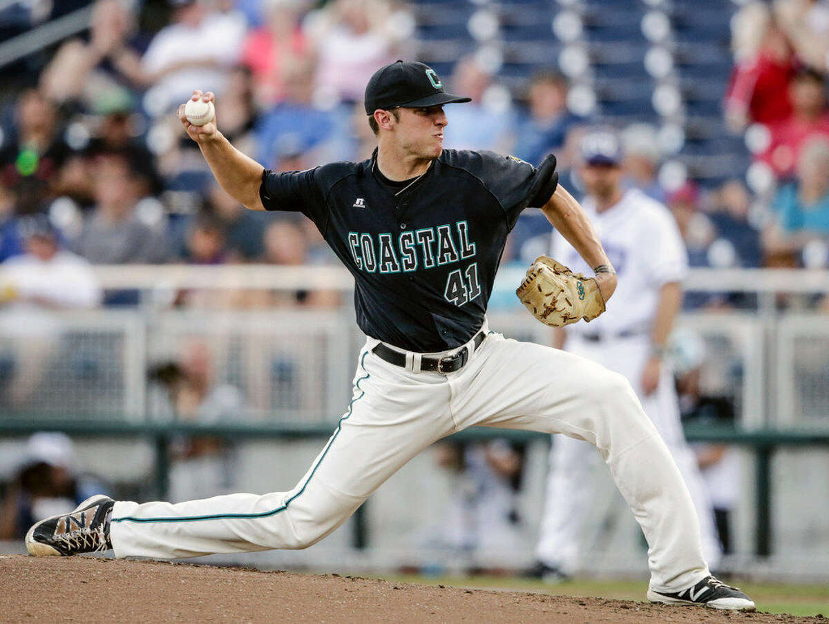 Coastal Carolina starting pitcher Andrew Beckwith throws against TCU during the first inning of an NCAA men's College World Series baseball game in Omaha, Neb., Friday, June 24, 2016. (AP Photo/Nati Harnik)