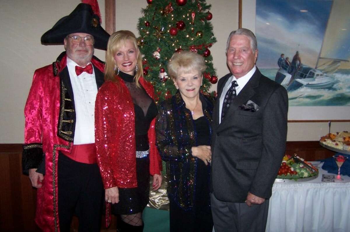 Jim Blair and his wife, Nelda, a University of Houston regent, are all decked out for the Lakewood Yacht Club New Year's Eve Celebrate as they join Neal and Leona Pleasant.