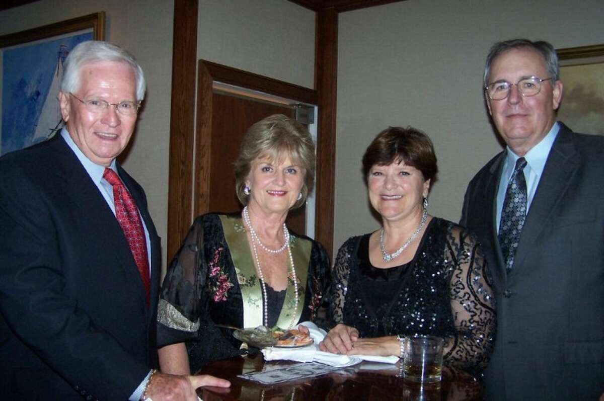 Frank and Ann Muffeny, left, say hello to Mike and Kathy Hall during Lakewood Yacht Club New Year's Eve Celebration.