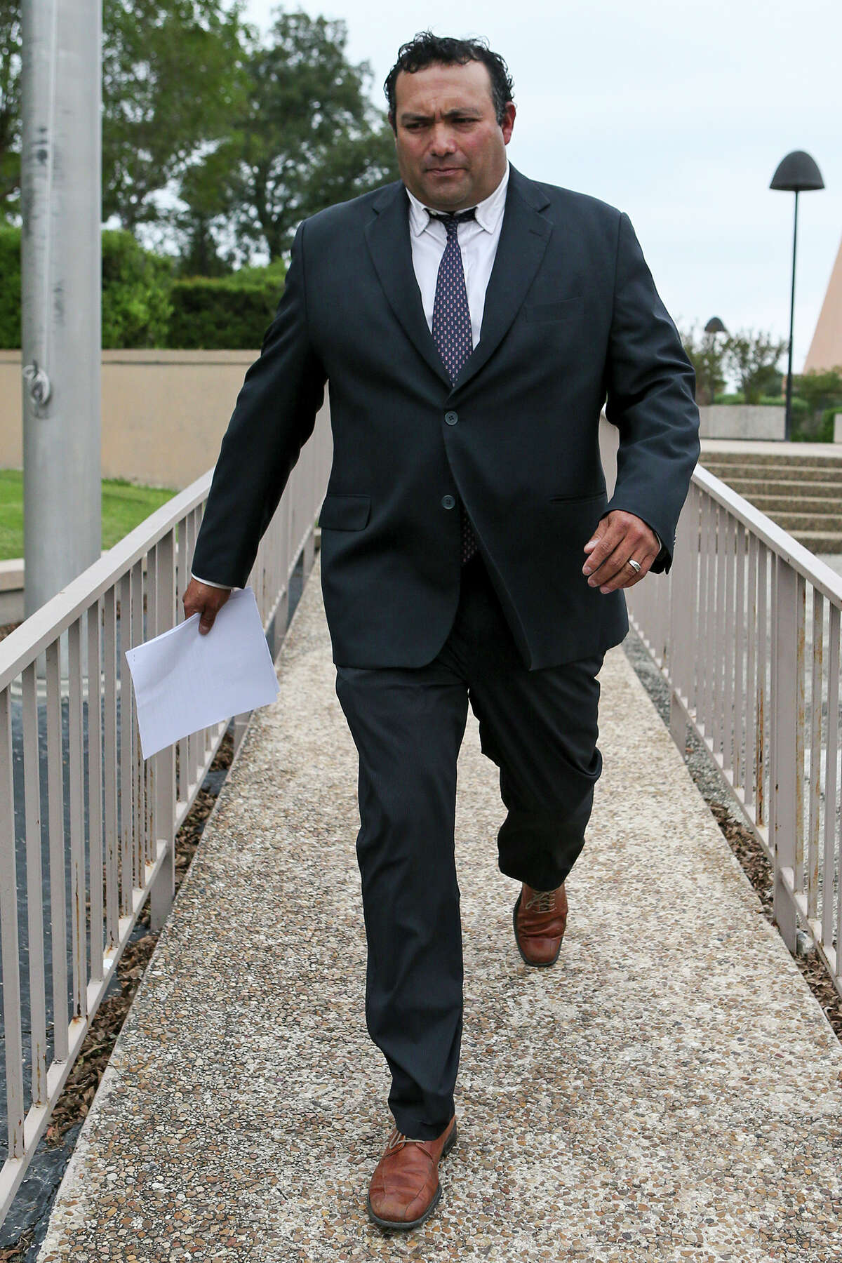 Former Harlandale ISD board trustee Joshua Cerna leaves the Federal Courthouse on Tuesday, Sept. 27, 2016, after pleading guilty to a fraud conspiracy charge as part of an FBI corruption investigation. MARVIN PFEIFFER/ mpfeiffer@express-news.net