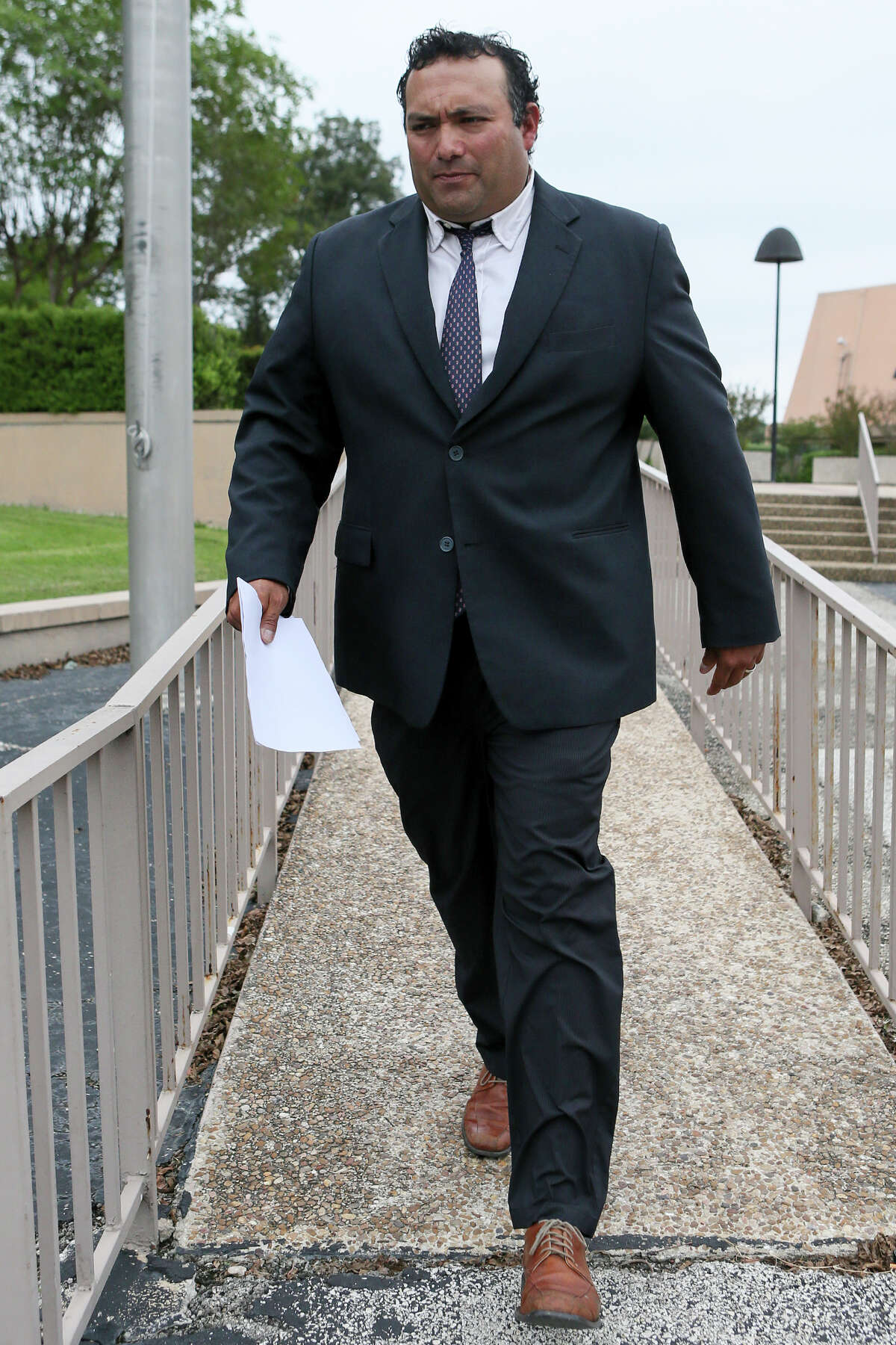 Former Harlandale ISD board trustee Joshua Cerna leaves the Federal Courthouse on Tuesday, Sept. 27, 2016, after pleading guilty to a fraud conspiracy charge as part of an FBI corruption investigation. MARVIN PFEIFFER/ mpfeiffer@express-news.net