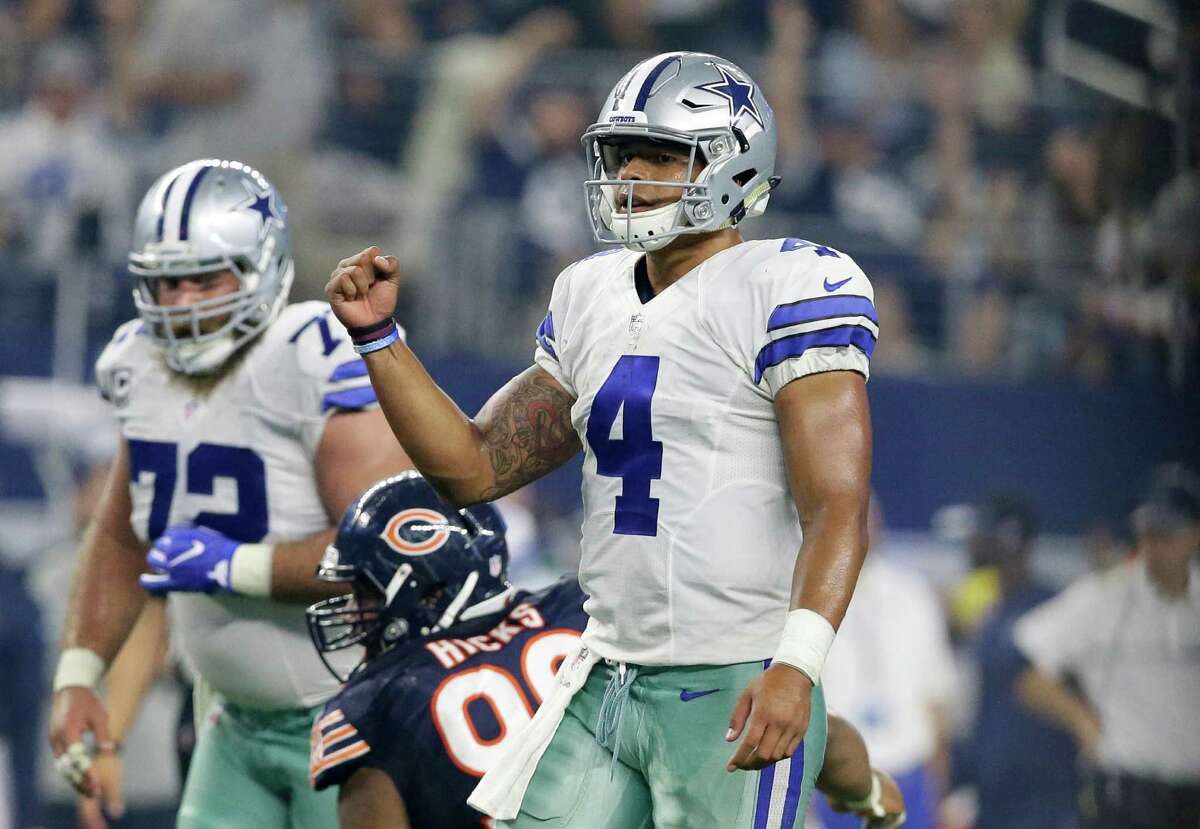 Dallas Cowboys quarterback Dak Prescott (4) celebrates with wide