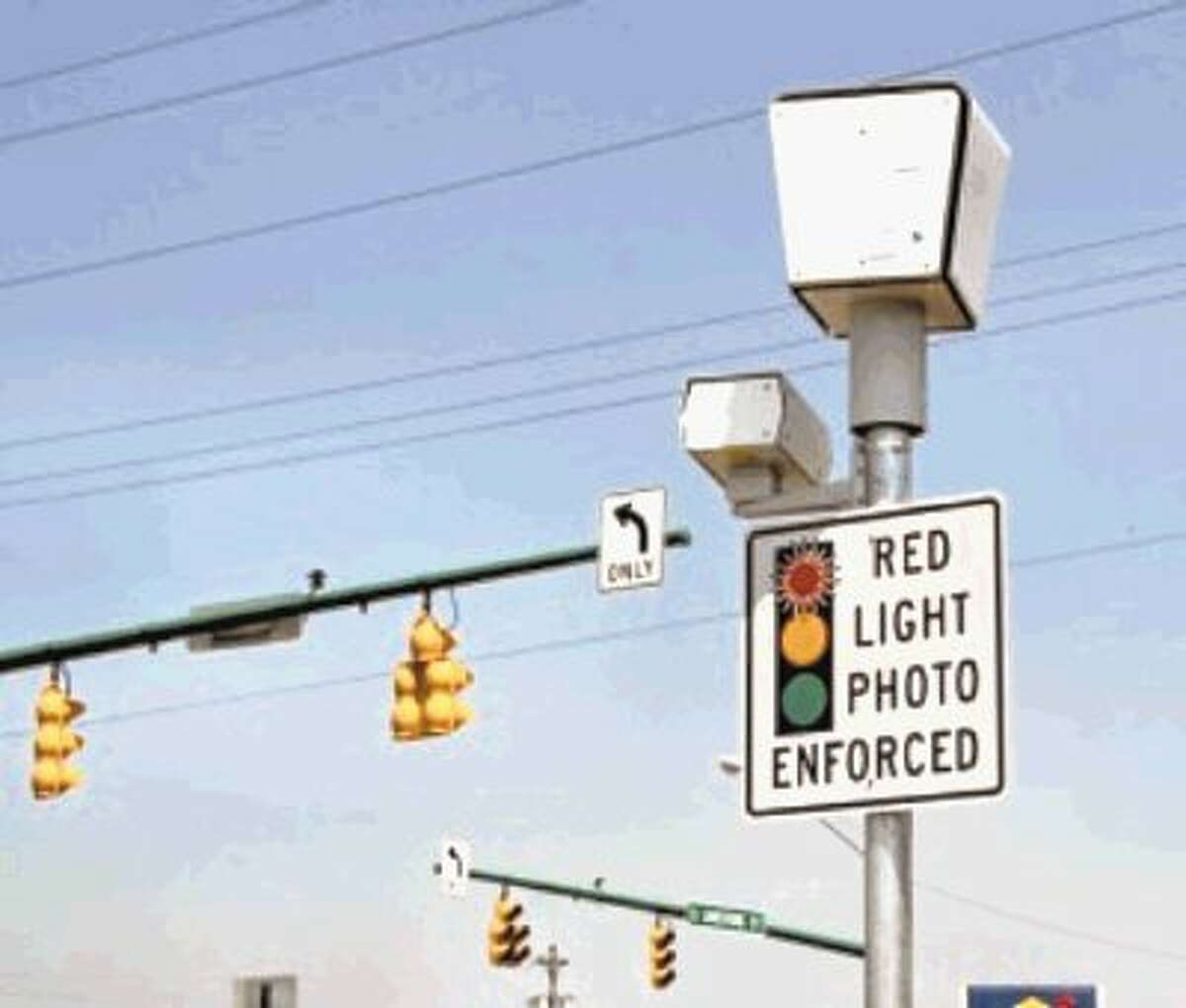 No more: Houston could end redlight camera battle by paying a nearly $5 million settlement.