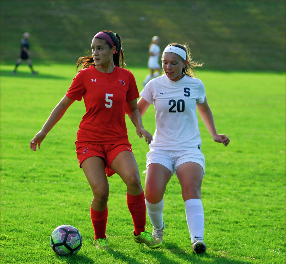 Greenwich's Kimberly Kockenmeister, left, and Staples' Annie Amacker battled for possession during a girls soccer game on Tuesday, September 27th, 2016.
