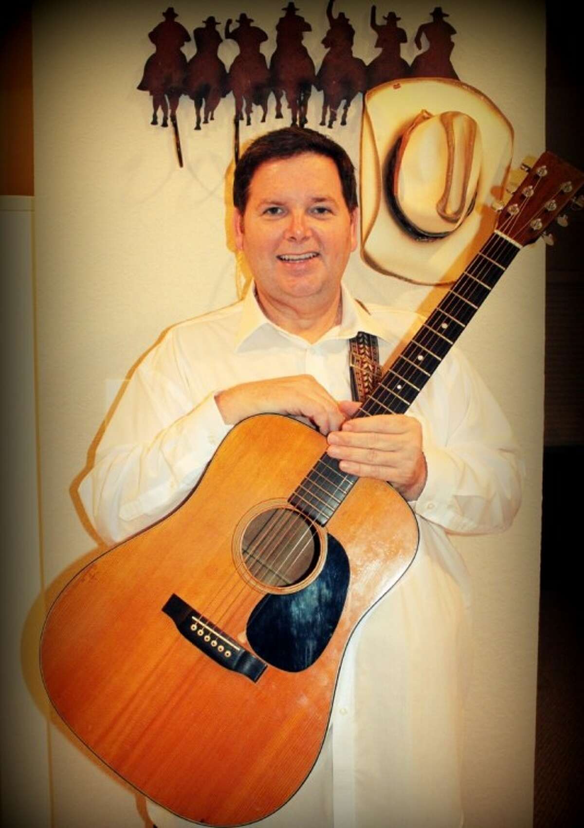 Pasadena Police Sgt. Ronnie Jordan with his vintage Martin guitar. That purchase in 1970 began a long involvement in music. As pastor of Cathedral of Praise Assembly Church at11303 C.E. King Pkwy, Houston, Jordan has a message of faith and hope.