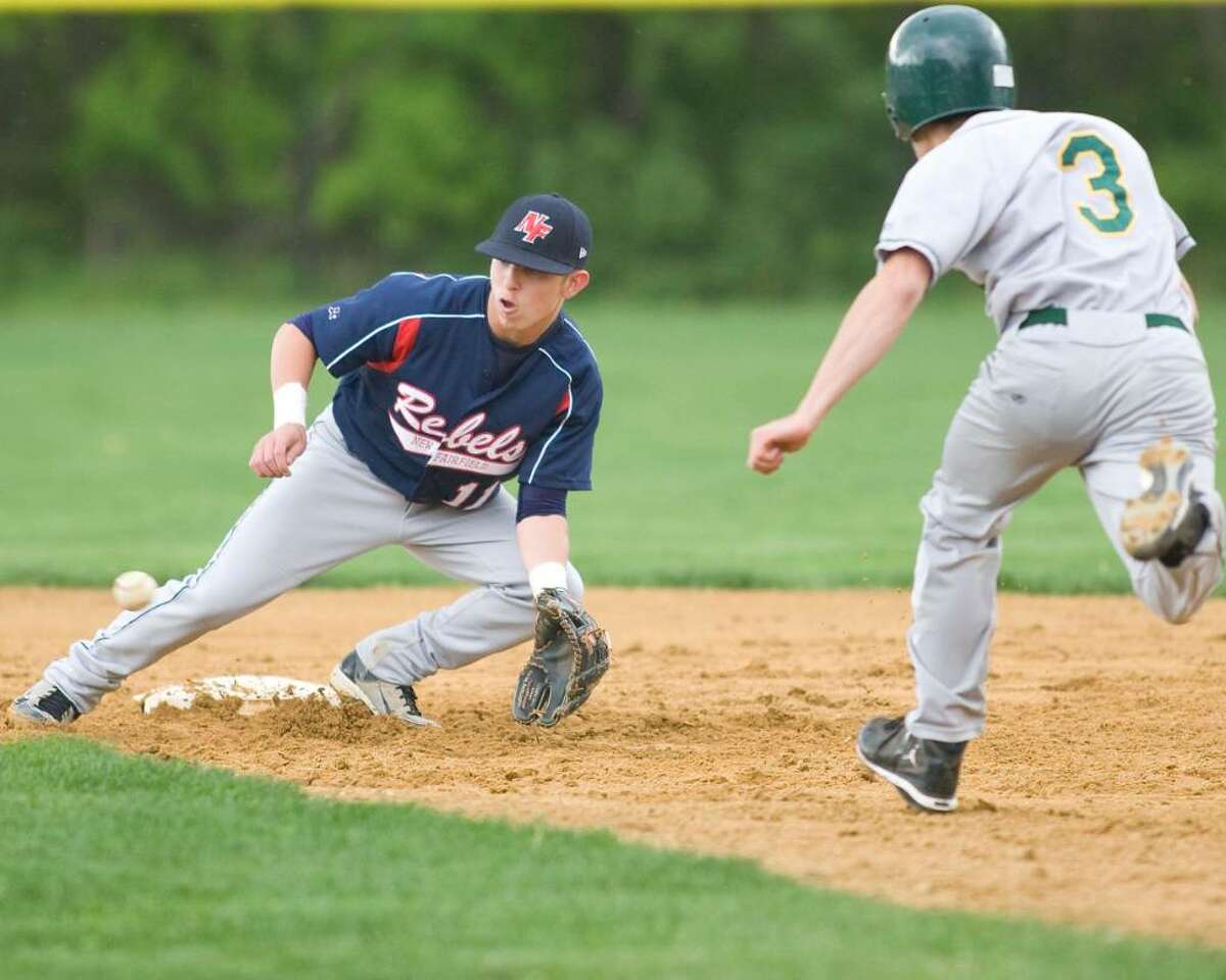 New Fairfield's Jimmy Andreozzi (11) has the throw in time to catch New Milford's Ken Stone trying to steal second base Tuesday at New Fairfield High.