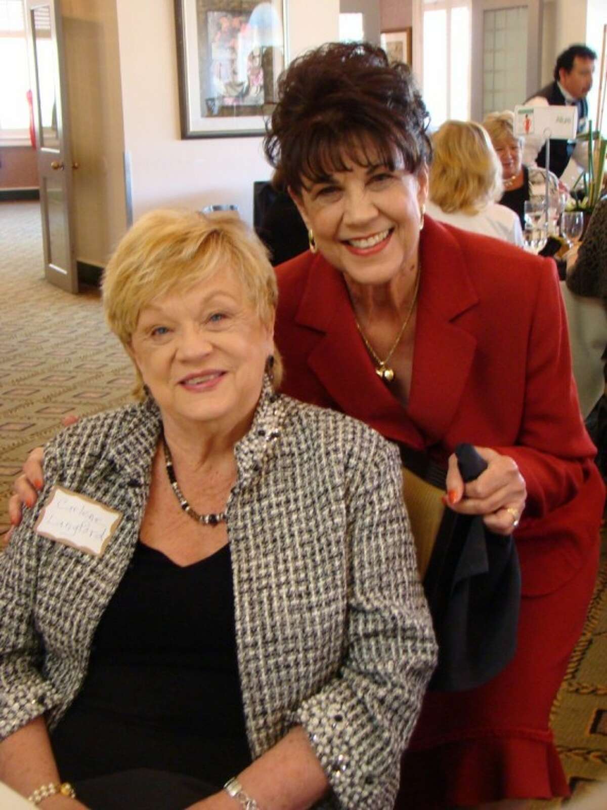Bay Oaks Women's Association President Janet Greenwood, right, is happy to see Carlene Langford as she mingles with the crowd at the March luncheon.