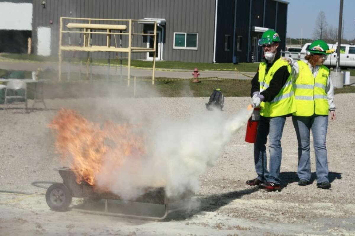 Several CERT team members undergo the fire suppression portion of the sixth annual CERT Rodeo Feb. 11.
