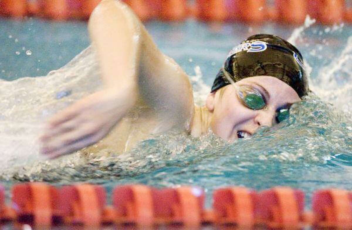 Clear Springs swimmer Deandra Denney goes through her paces in the freestyle during the region competition. — Photo by Patric Schneider