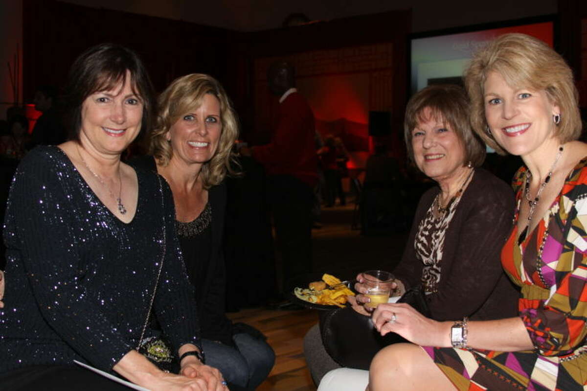 Pictured (L to R): Lynne Humphries, Diane Amundson, Dee Koch and Nancy Olson enjoying the festivities at Fort Bend Cares Road Trip to the Orient.