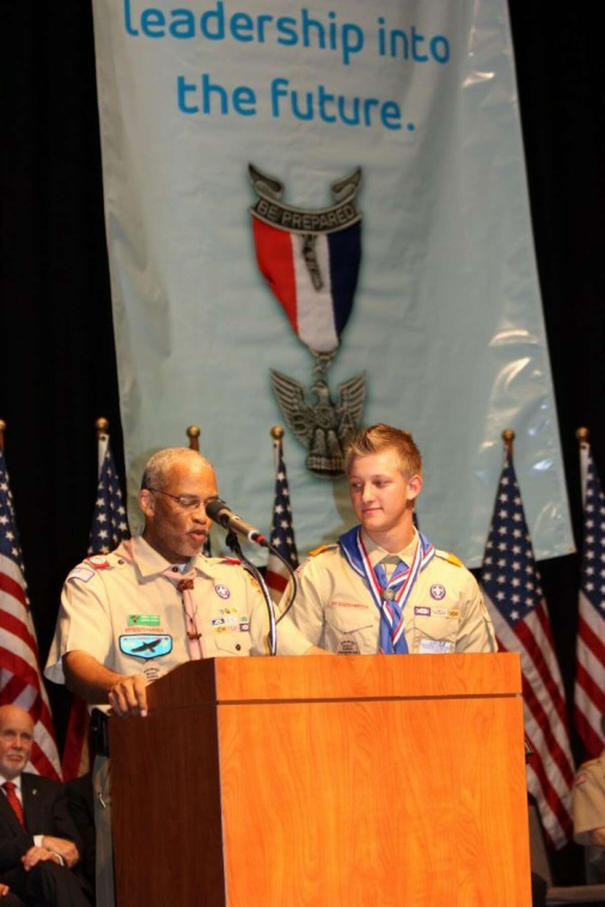 Ronald Thomas presents the Eagle Scout Service Project Award to Tyler Schild.