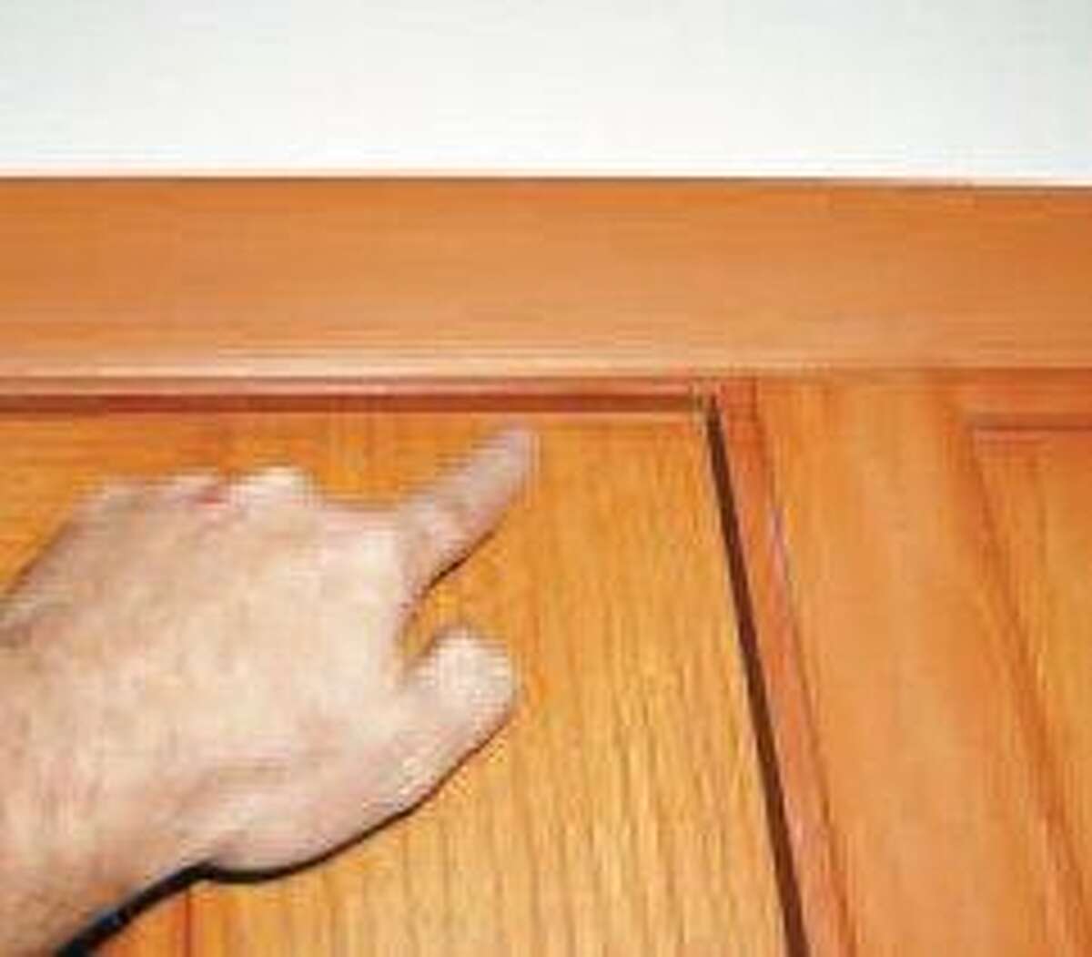 Washers behind a hinge help doors stay latched