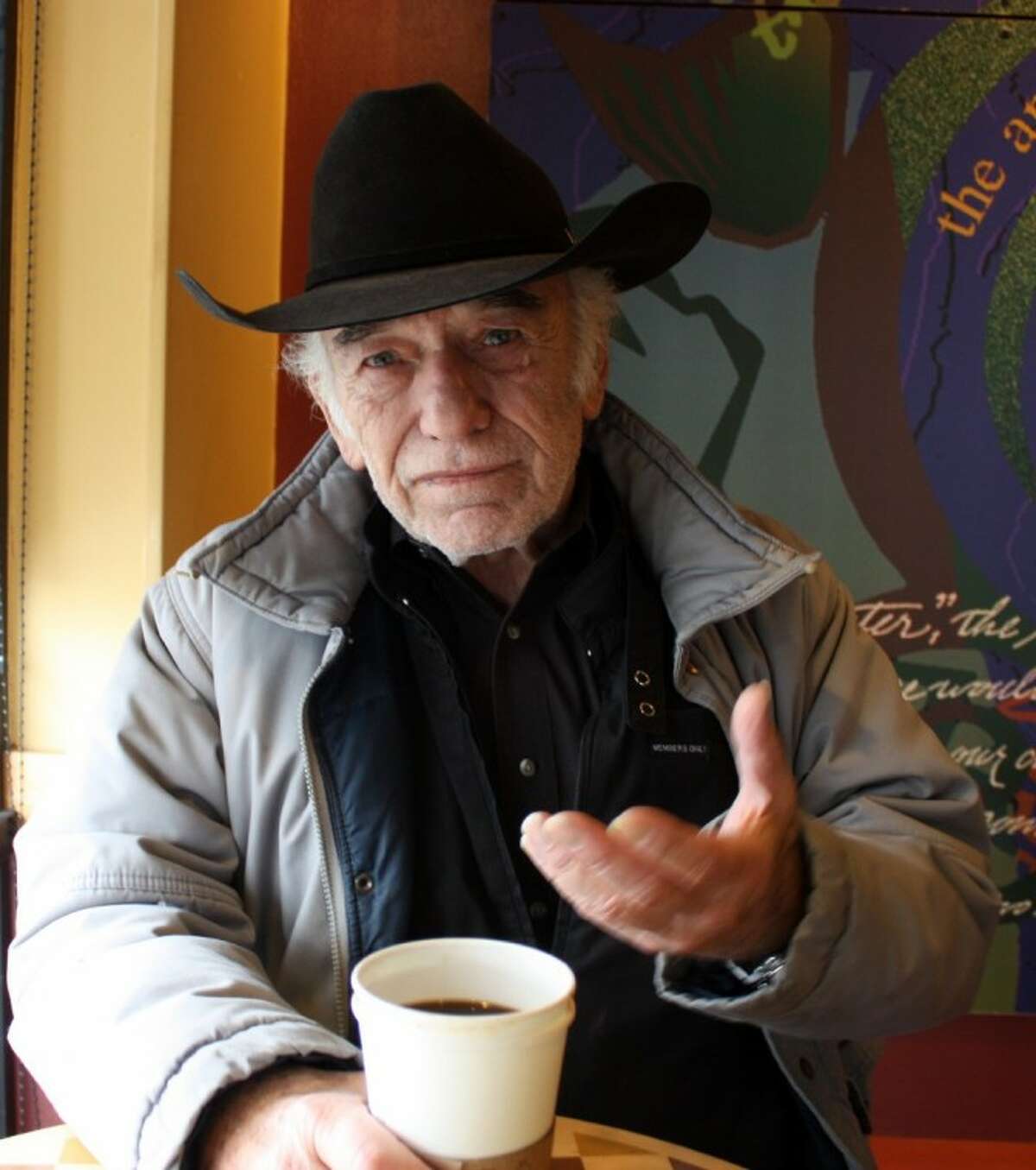 Actor James Drury enjoys a cup of coffee and conversation recently on a rainy day in Houston. Drury is marking the 50th anniversary of his long-running television show, The Virginian. “It was a great experience in my life. I never had a bad day at work,” he said.
