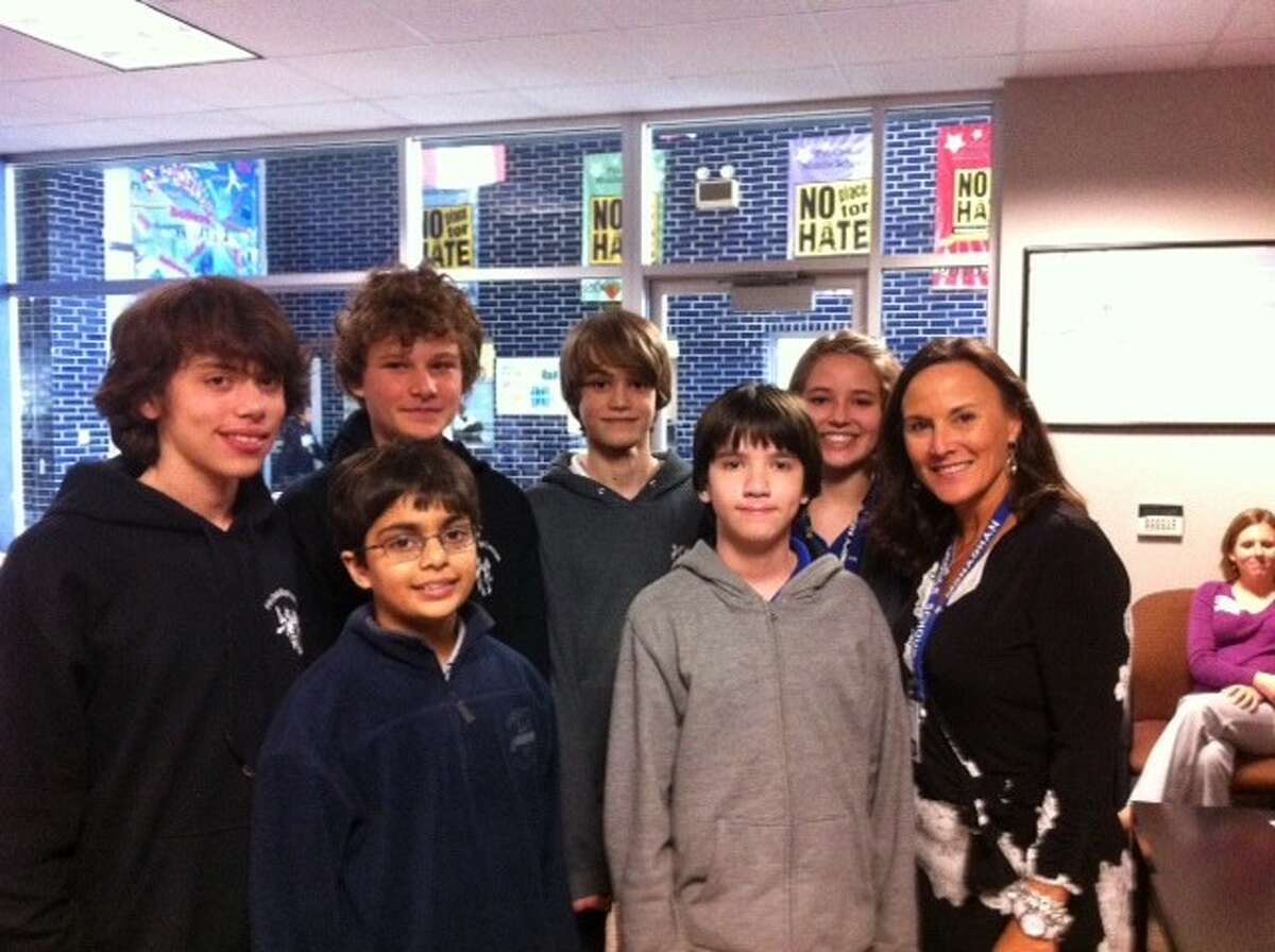 Eight-grade team Patrick Revilla, Mihir Pethe, Noah Switek, Silas Strawn, Jackson Hassell and Lillian Evans with Pin Oak Middle School principal Susan Monaghan. (Photo submitted by Pin Oak Middle School PTO)
