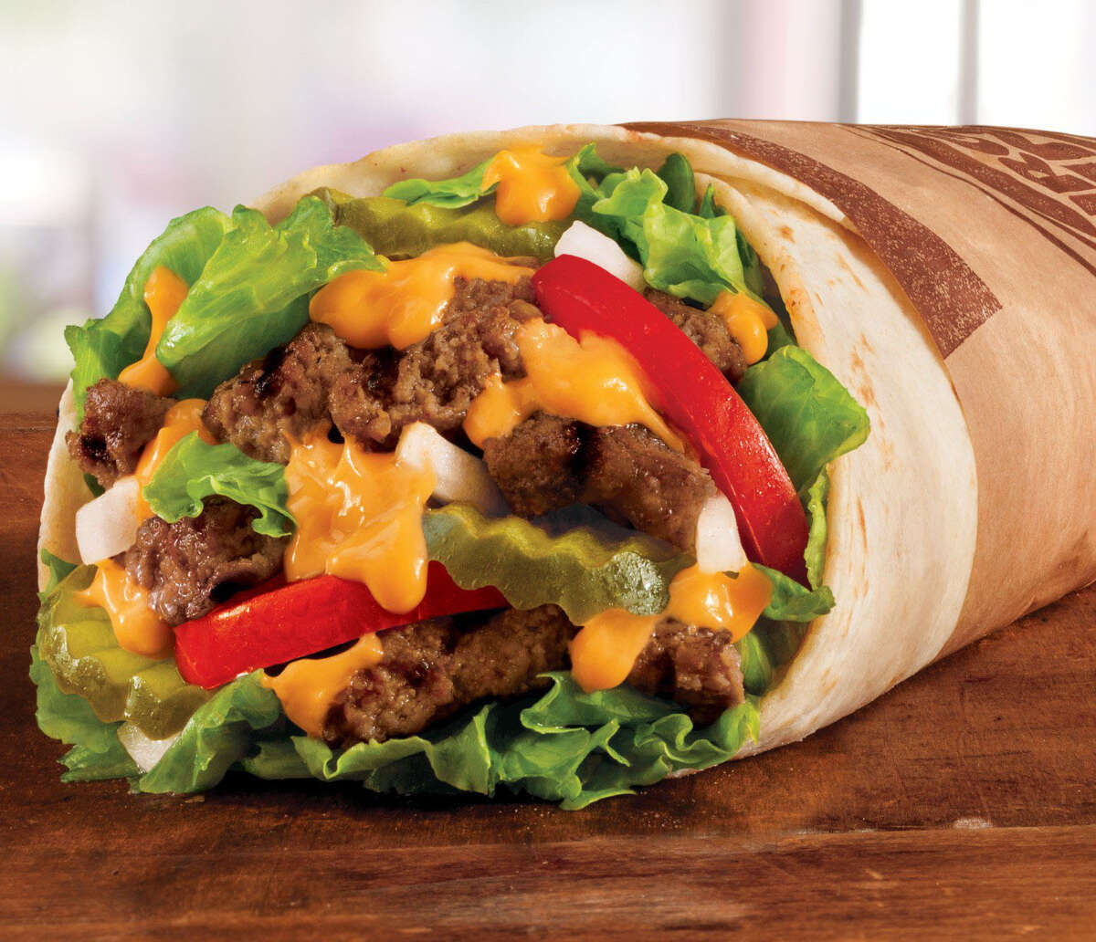 Whopperrito: The chain's iconic burger with a shot of Tex-Mex, stuffed neatly in a warm, soft flour tortilla. Total calories: 570. Fat grams: 26. Sodium: 1,110 mg. Carbs: 59 g. Dietary fiber: 2 g. Protein: 29 g. What Hoffman says: OK, I get it, a Whopper rewrapped as a wrap sandwich. But did Burger King have to stay so faithful to the Whopper breakdown and keep the pickles? There's something so wrong and unnatural about pickles in a burrito.