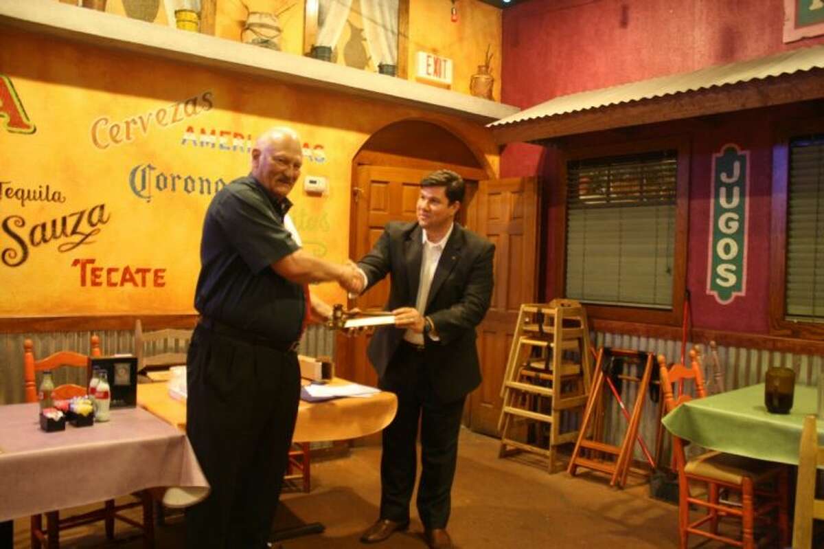 The Pearland Rotary installed its new president Tuesday with a late Tuesday afternoon dinner and ceremony. Immediate Past President (right) Jonathan Salvato presented Bob Lewis with a gavel and introduced him as the club's new president.