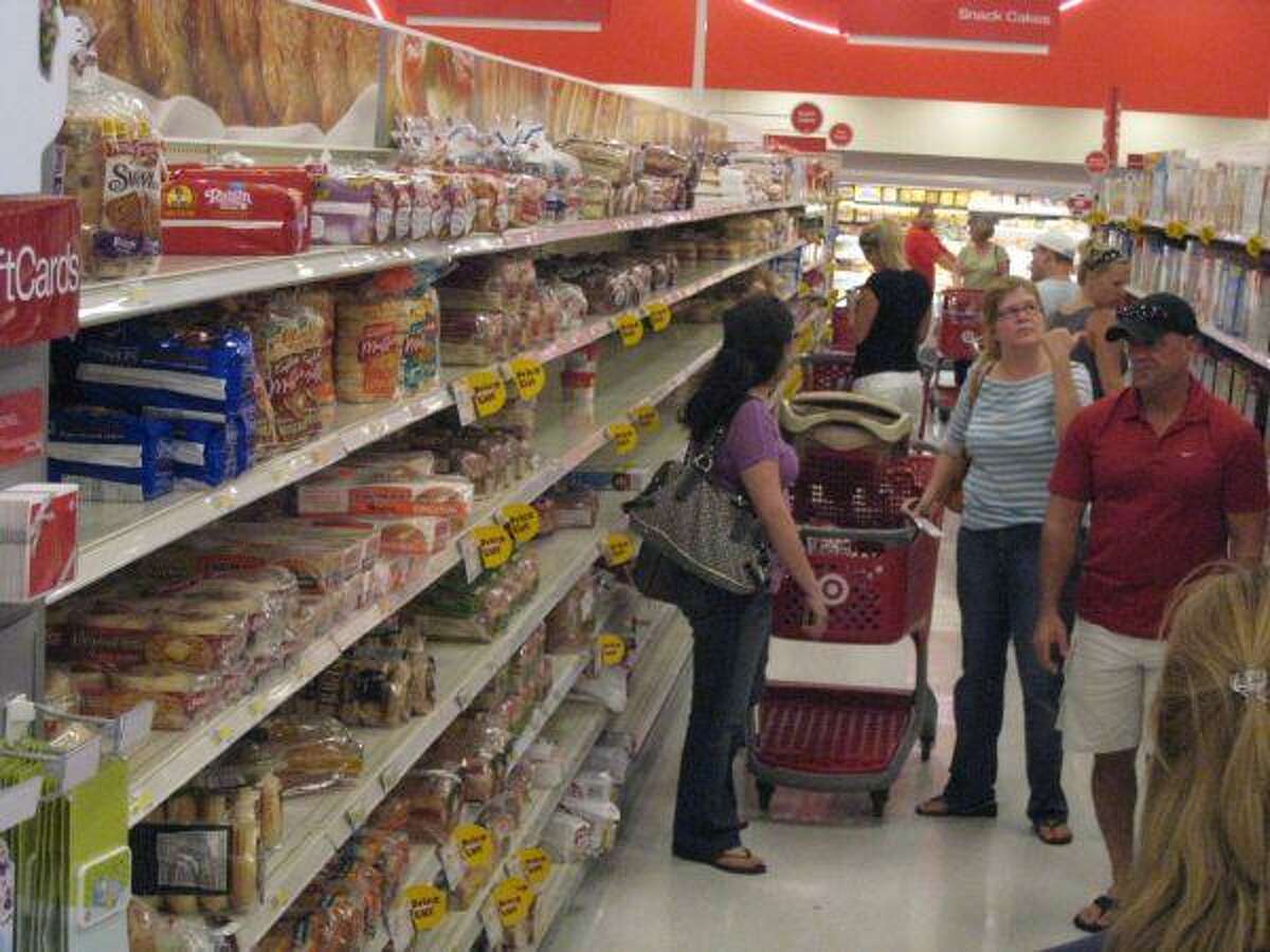 FILE - Customers stock up on supplies at a SuperTarget in Atascocita, Texas on Sept. 11, 2008. The store is now the center of a racial discrimination suit alleging managers falsely accused a customer of theft.