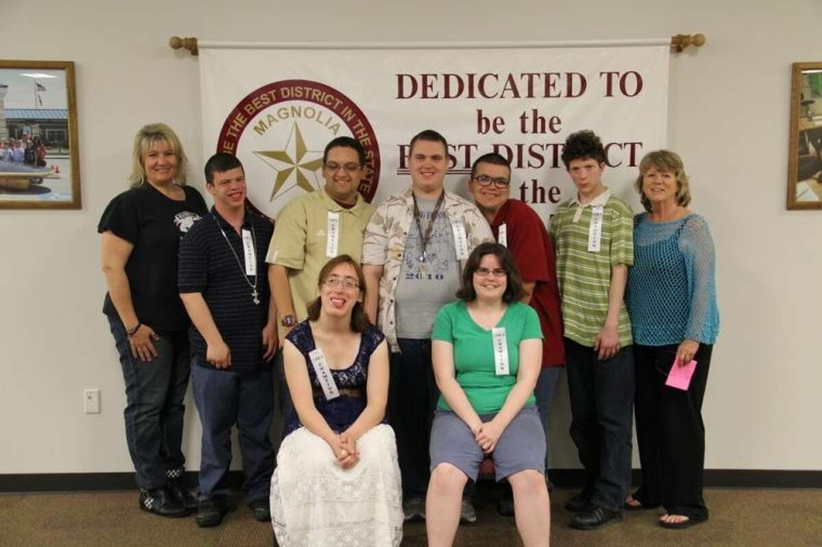 Members of the Magnolia ISD Special Olympics basketball team are, front row, Chelsea Guerrero and Courtney Ashlock; back row, Coach Rose Stewart, Sean Borgstrom, Corey Mishler, David Decker, Donald Brown, Dustin Allen and Coach Patty Havlin. Not pictured are Andrew and Jonathon Westbrook.
