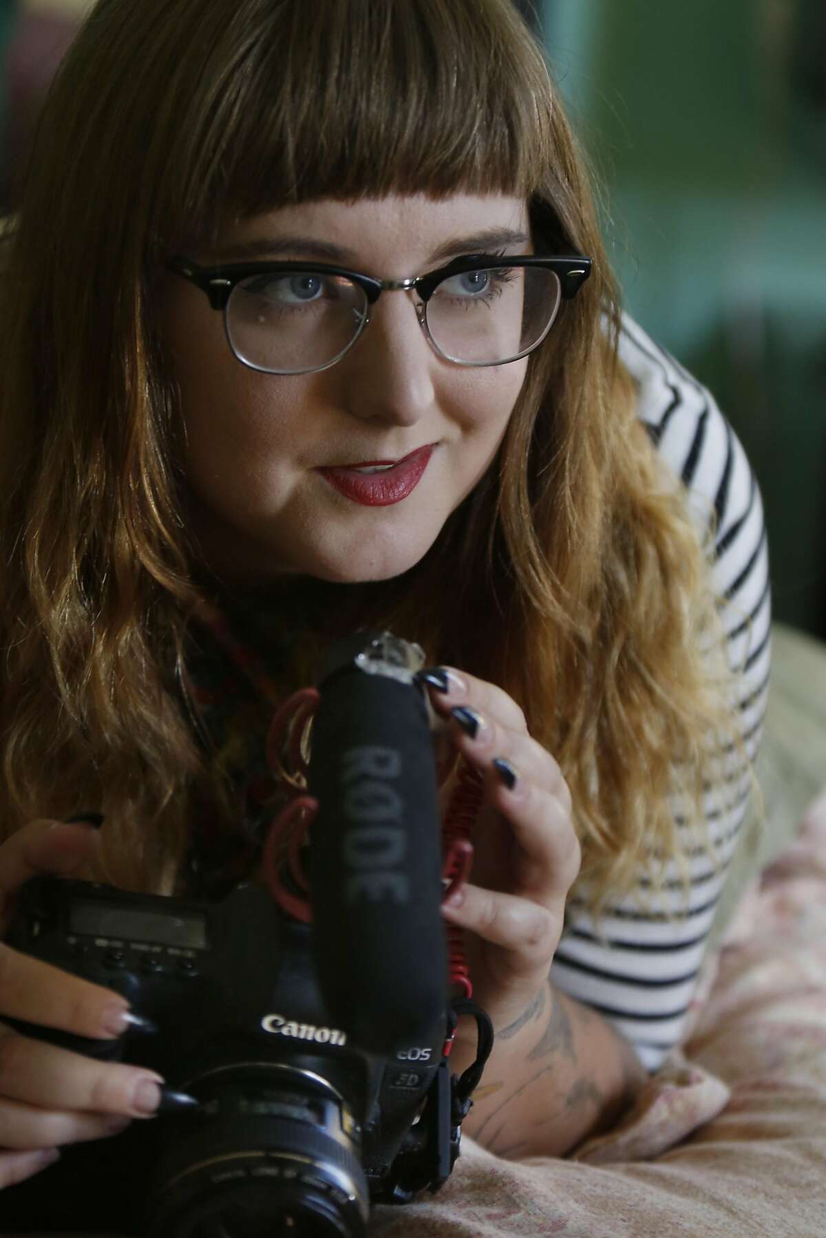 Isabel Dresler, adult film producer, is seen with her camera in her bedroom which she sometimes uses as a set on Wednesday, September 28, 2016 in Emeryville, California.