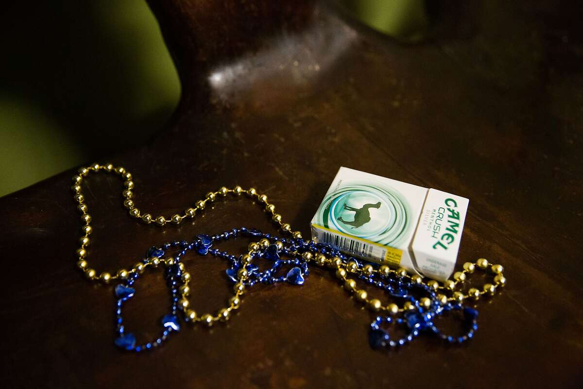 Two bead necklaces and a pack of cigarettes sit on the waiting bench after Inay's Asian Pacific Cuisine's final dinner and drag show on Friday, Jan. 29, 2016. (GRANT HINDSLEY, seattlepi.com)