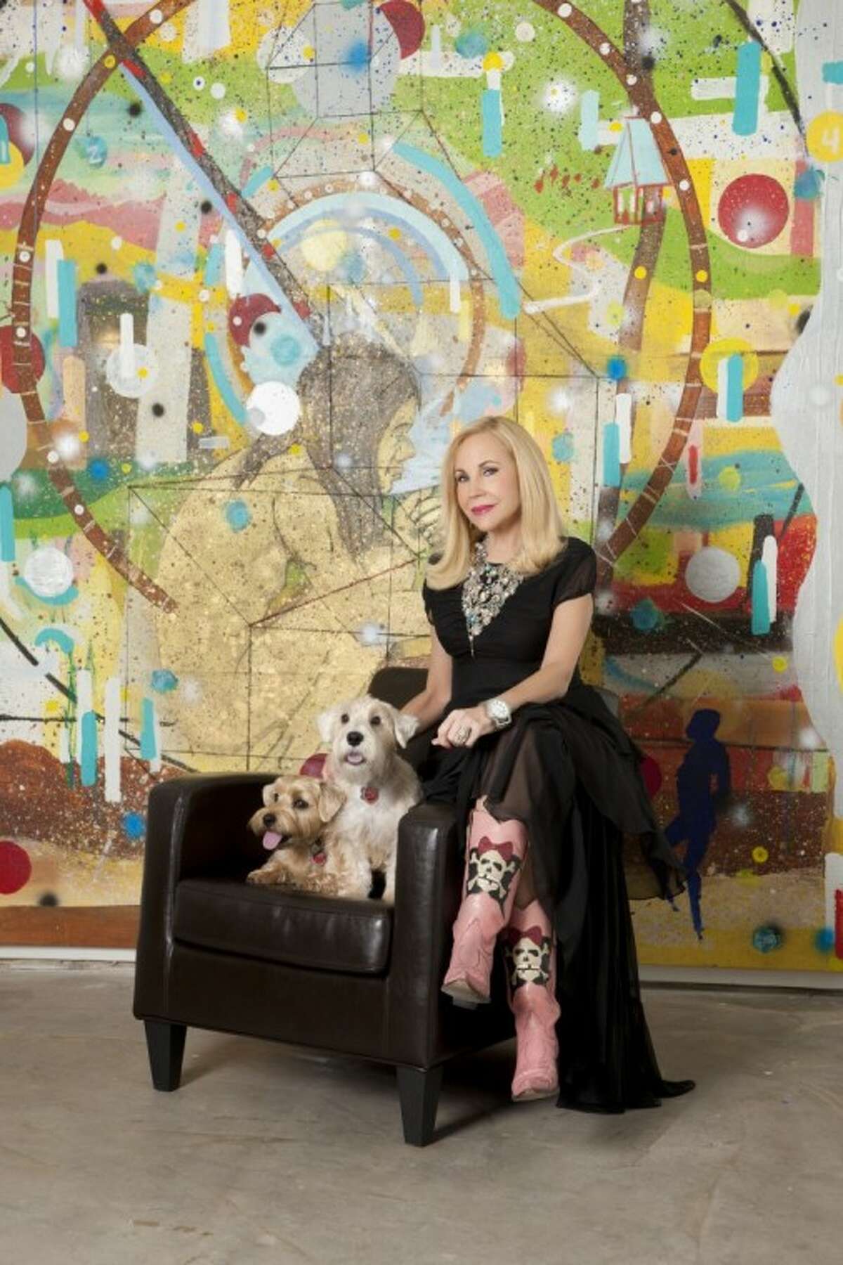 Houston artist and arts patron Carolyn Farb is pictured with her “two boys” Maximilian, right, and Lucus, left. The artwork in the background is by Angelbert Metoyer and it titled “My Last Vision in Memphis (When Dirt turns to Gold).”
