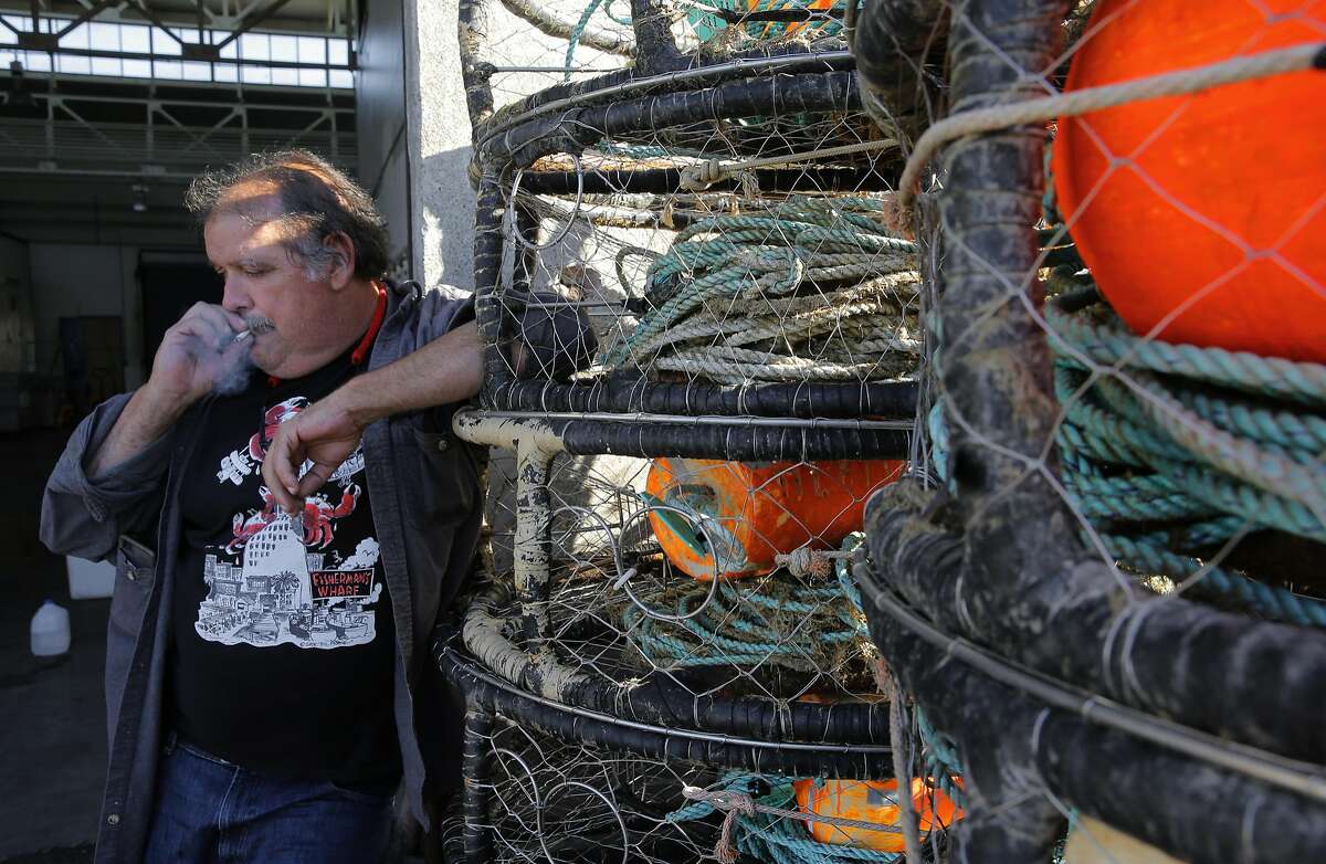 Larry Collins, the president of the San Francisco Community Fishing Association stands near crab pots on Pier 45 in San Francisco, Calif. on Thurs. November 5, 2015.