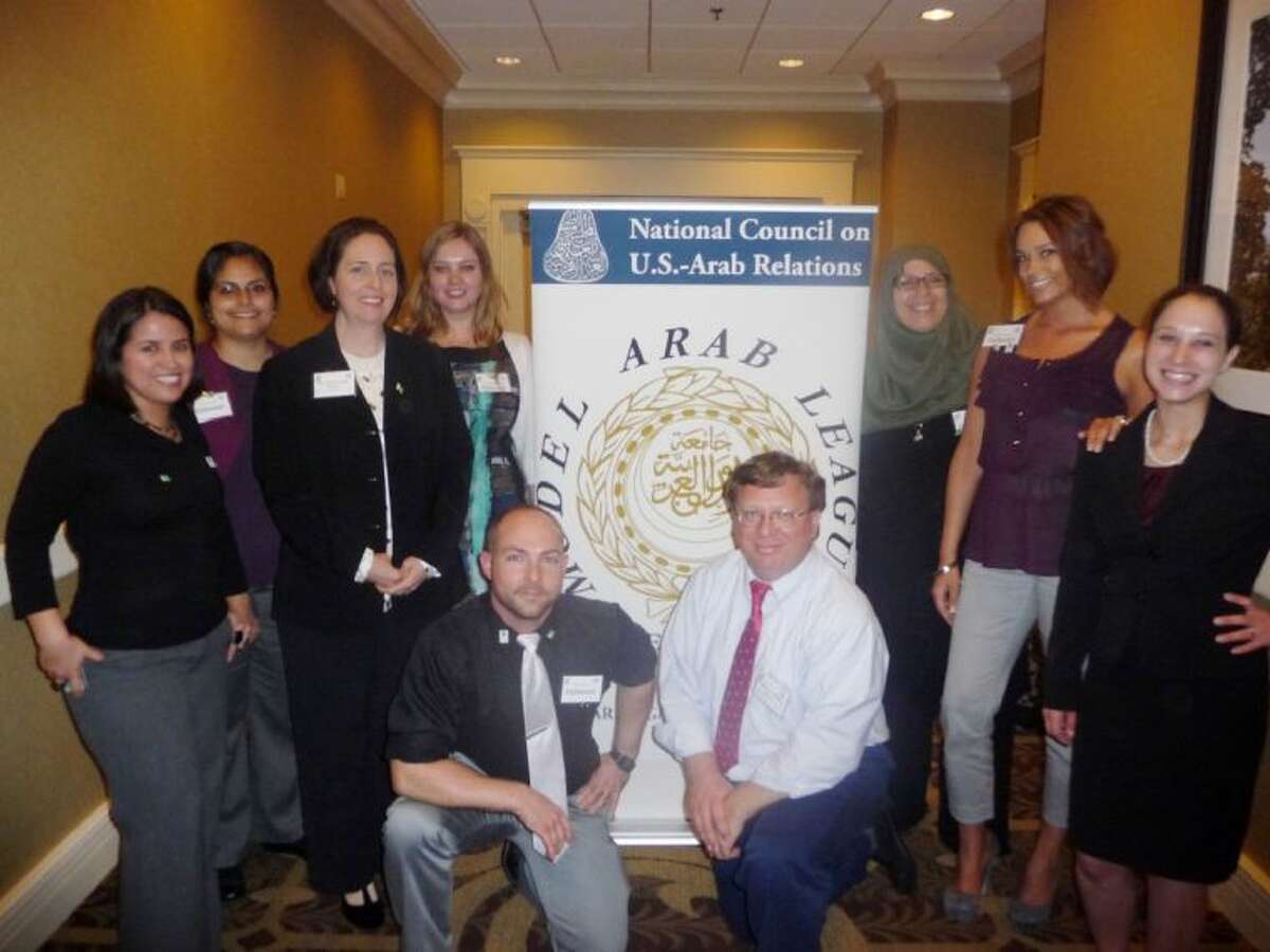 In April, seven University of Houston-Clear Lake students participated the National Council on U.S. - Arab Relations Model Arab League competition at Georgetown University in Washington, D.C. Pictured are the members of the council with two UH-Clear Lake professors including (left to right, back row) Monica Rincon of Pasadena, Nora Ventura of La Porte, Assistant Professor of Anthropology and Cross-Cultural Studies Maria Curtis, Jane Terekhova, Cindy Steffens, Andrea Strege and Kate Boggess; (kneeling, l to r) Nick Burns and Associate Professor of Sociology Michael McMullen.