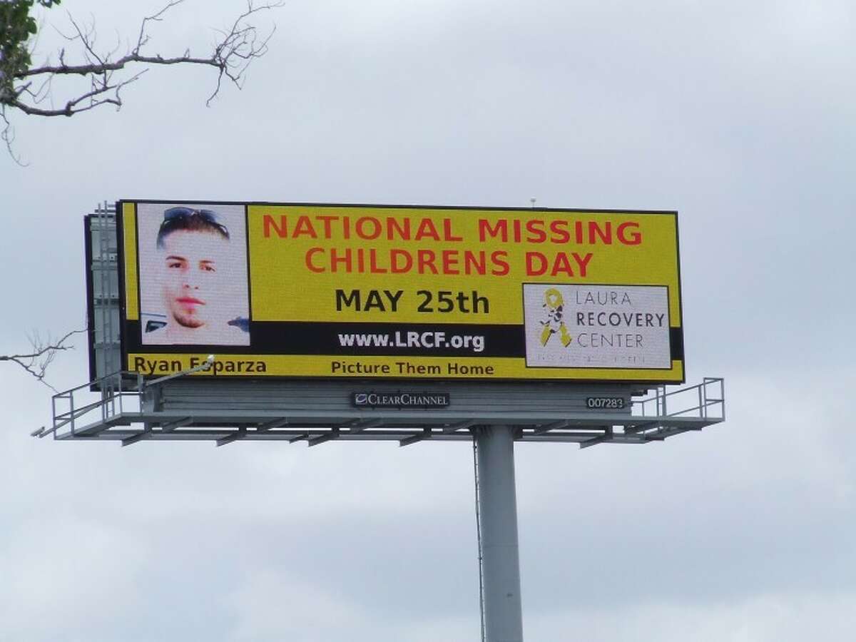 This double-sided digital billboard on Beltway 8 near Pasadena Boulevard shows the faces of eight different children that have gone missing between 15 years ago and last month. -Photo by Jeri Martinez/The Citizen