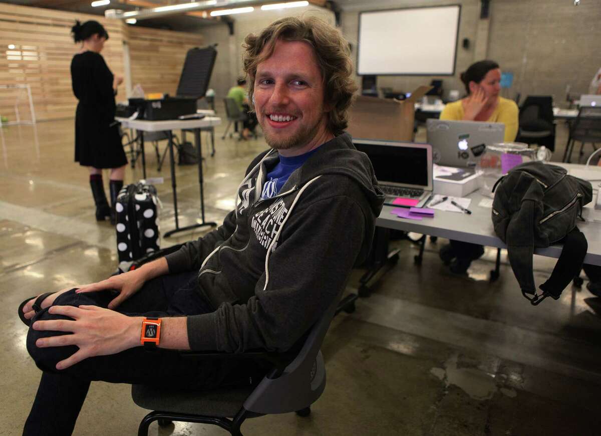 Wordpress founder Matt Mullenweg (middle) in his new office building in San Francisco, Calif., on Wednesday, July 24, 2013, where this coming weekend will be its annual WordCamp conference.