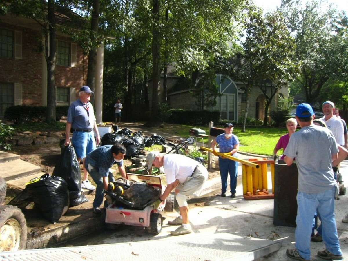 Volunteer teams meet to help neighbor clean up her home