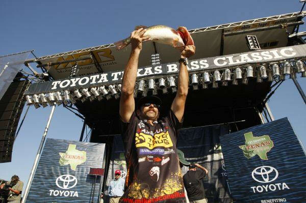Michael Iaconelli raises the 9-pound, 8-ounce bass he caught in last year's Toyota Texas Bass Classic on Lake Conroe.