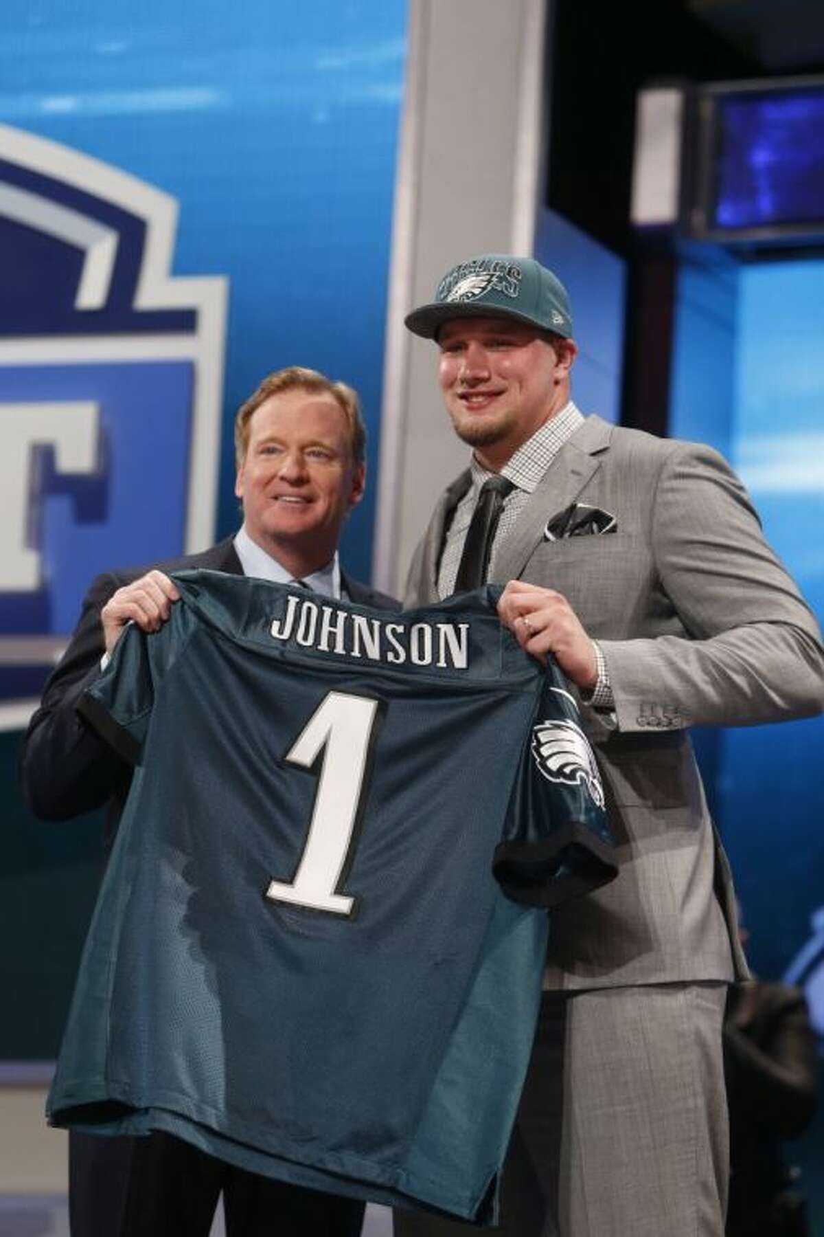 Tackle Lane Johnson from Oklahoma stands with NFL commissioner Roger Goodell after being selected fourth overall by the Philadelphia Eagles in the first round of the NFL football draft, Thursday, April 25, 2013 at Radio City Music Hall in New York. (AP Photo/Jason DeCrow)