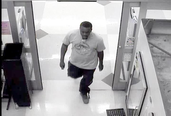 Suspect Sought In Grocery Store Robbery Case