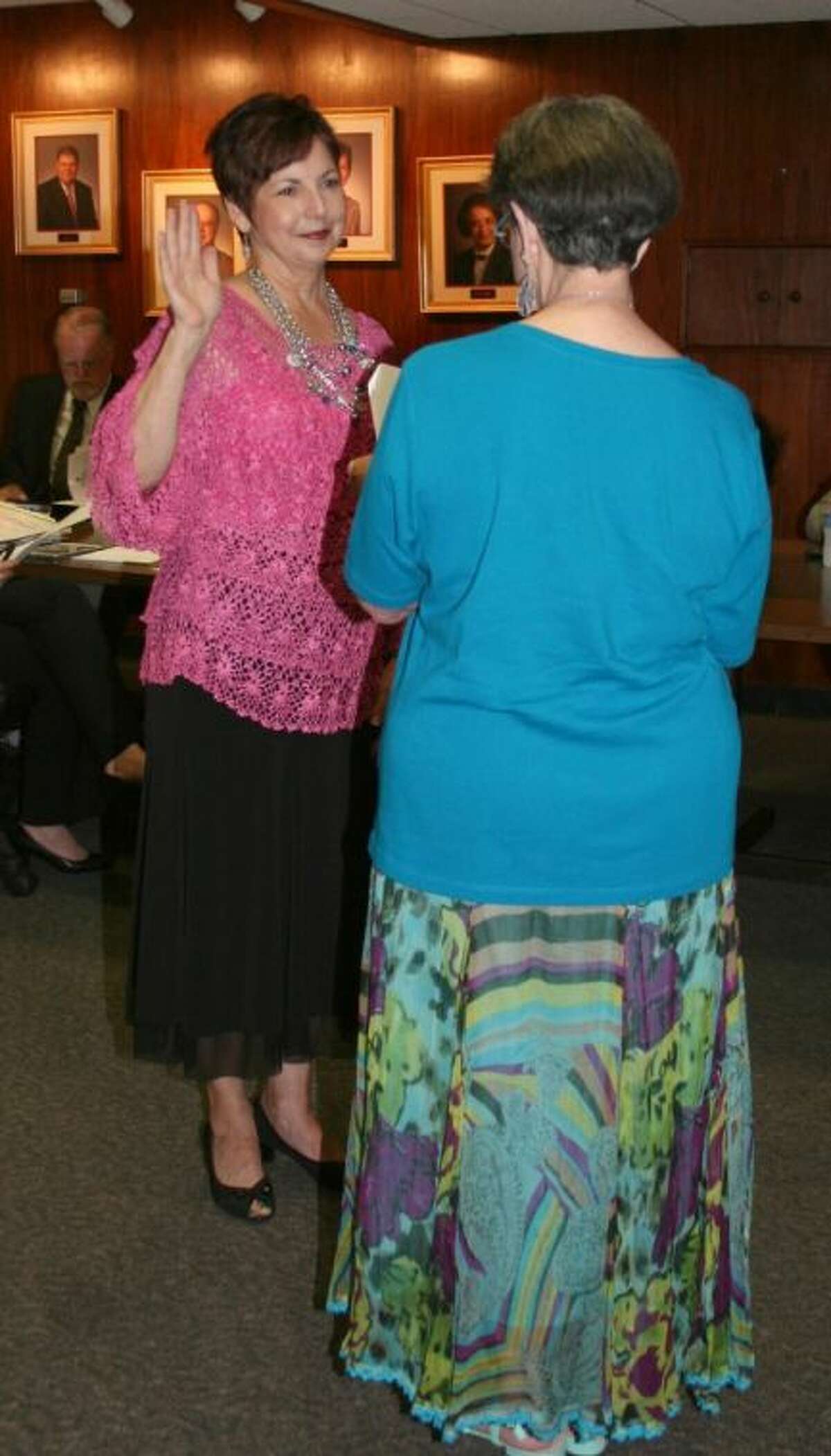 Rosalie Kettler takes the oath of office for a second term on the College of the Mainland board of trustees.