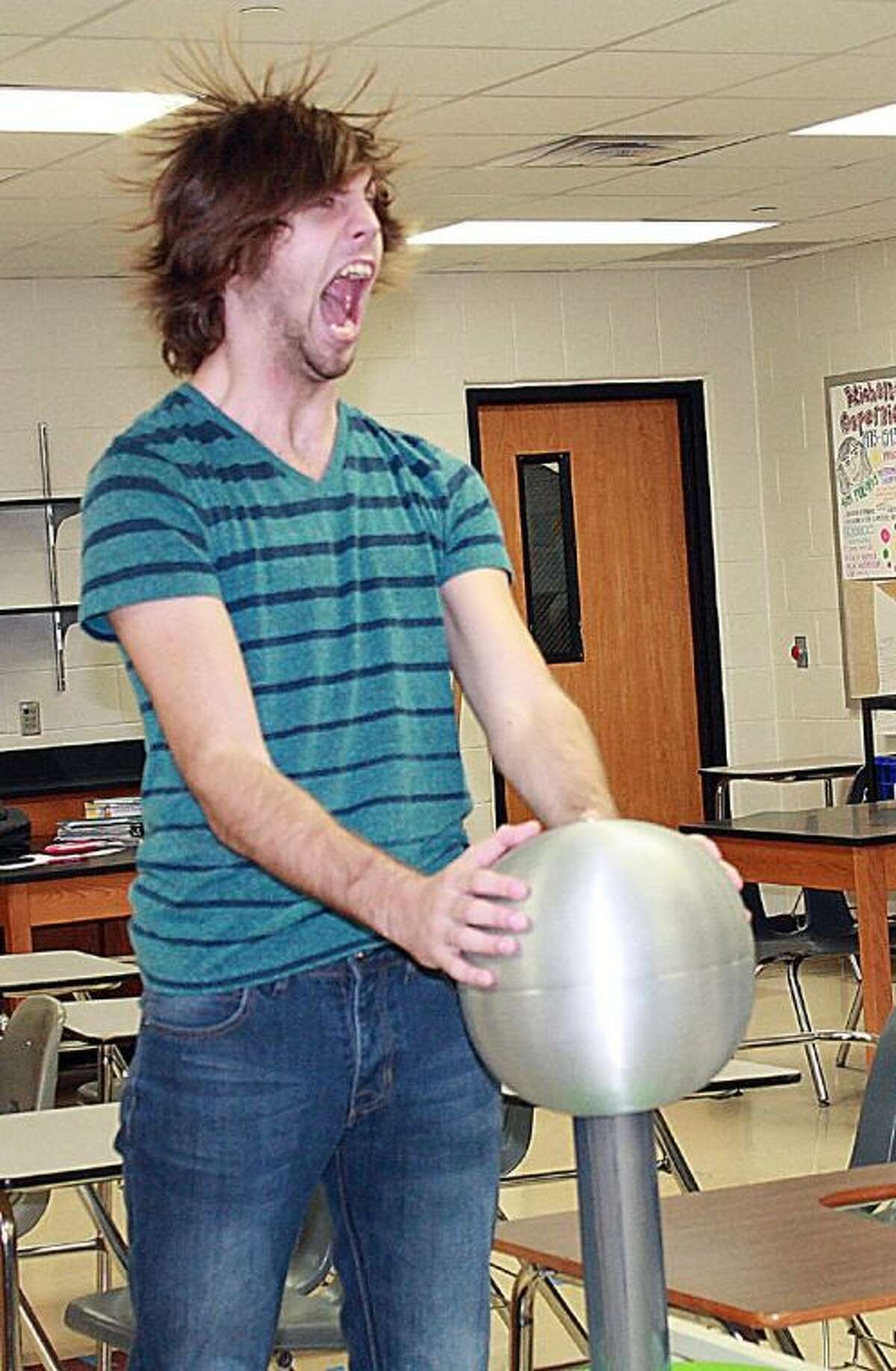 Jersey Village sophomore Jeleny Solorzano placed third in the Yearbook Academic Photo category of the NFPW High School Writing Contest for his photo. The original cutline reads, “Taking his turn in the physics lab, Dylan Golvach, senior, places his hands on the electromagnetic ball and lets out a scream in agony as he gets a quick shock.”