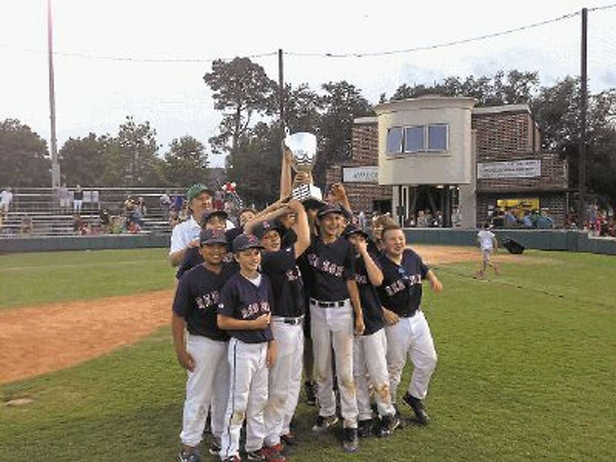 The Red Sox recently won the West University Little League Majors Division "World Series" championship game at Wallin field and the players hold up their huge trophy. The team was managed by Joe Bailey along with coaches Clay Didway and Joe Woodcox. Connor Bailey, Daniel Davis, Alan Diaz, Kevin Didway, Hunter Hernandez, Walter Hlavinka, Hayden Mount, Wilson SheafferJacob Van Brunt, Nico Wilson, and Drew Woodcox are the players on the Red Sox.