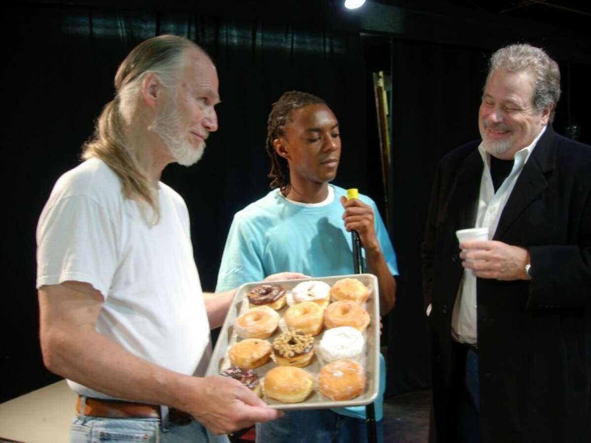 Max (Scott Holmes) makes another attempt to buy the Superior Donuts shop from Arthur (John Stevens), while Franco (Sam Flash) listens with disapproval during a rehearsal of Theatre Southwest’s production of “Superior Donuts.”