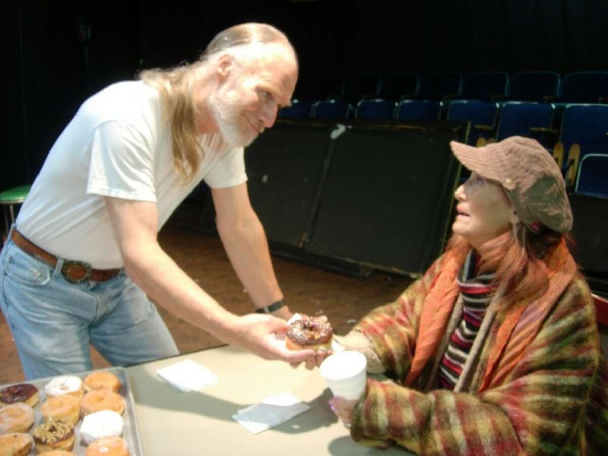 Arthur (John Stevens) gives breakfast to the homeless Lady Boyle (Bobbie Giachini) in a reharsal of Theatre Southwest’s production of “Superior Donuts.”