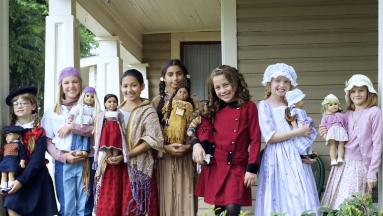 Modeling American Girl clothes: Girls and their dolls take