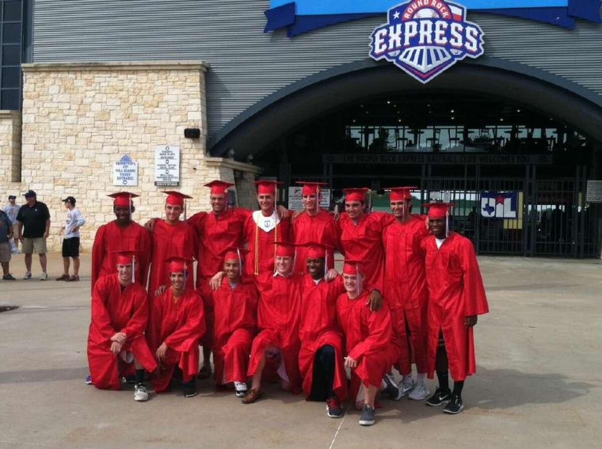 Dulles HS seniors that play for the varsity baseball team, gathered in front of Dell Diamond in Round Rock today in their caps and gowns.