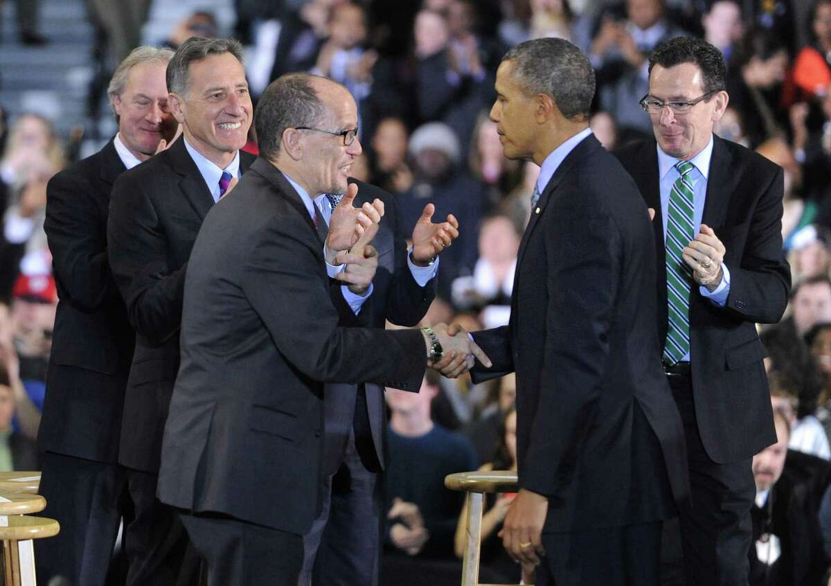 President Barack Obama with Secretary of Labor Thomas Perez in March 2014 in New Britain, Conn., joined by Connecticut Gov. Dannel P. Malloy, right.