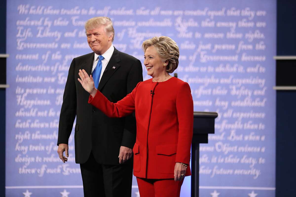 FILE-- Hillary Clinton and Donald Trump take the stage for their first presidential debate, at Hofstra University in Hempstead, N.Y., Sept. 26, 2016. As Election Day approaches in the United States, the Chinese are paying closer attention to the selection of the next president. Government censorship, the language barrier and an unfamiliarity with American political conventions have left many Chinese confused about the process. (Damon Winter/The New York Times)