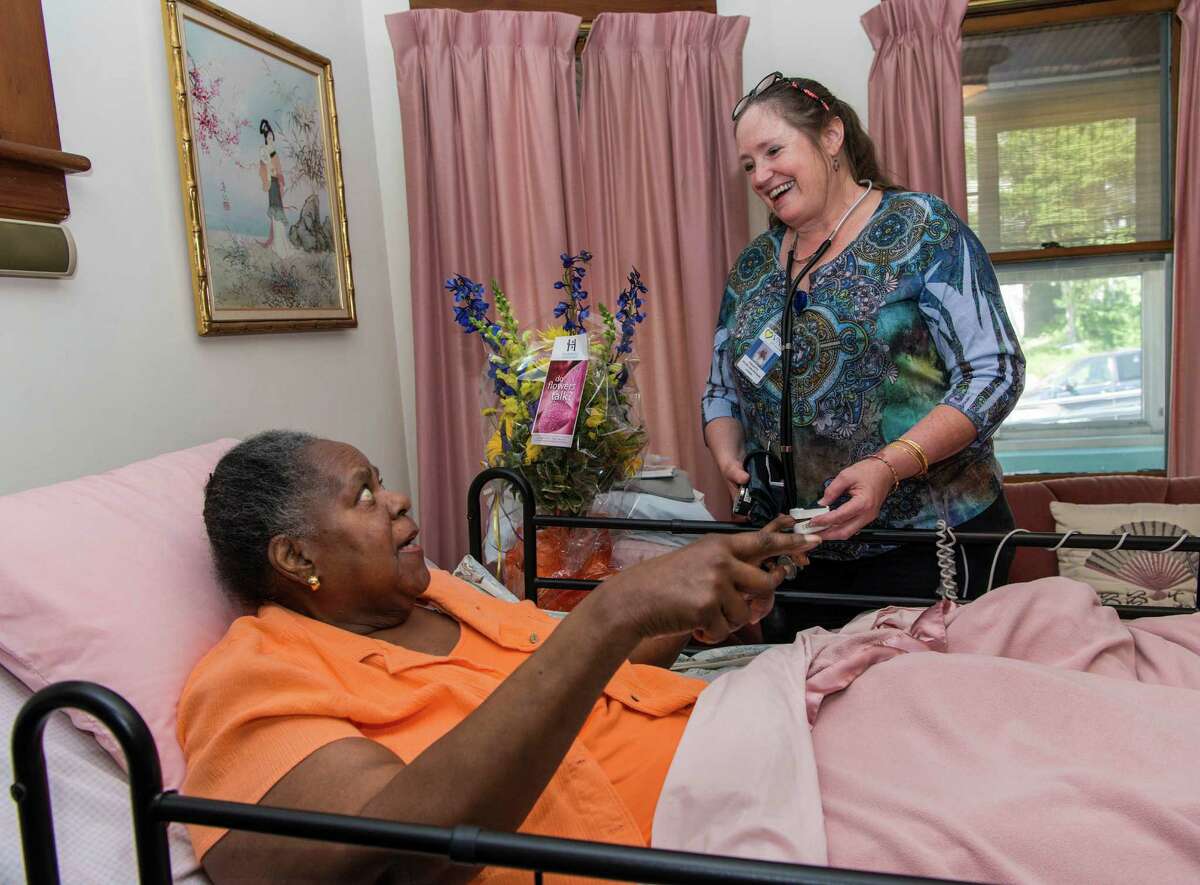 Virginia Oliver gets a visit at her home in Bridgeport from Collette Sengupta of the Visiting Nurse Services of Connecticut on June 24. With this visit the Visiting Nurse Services of Connecticut reached the 10 million patient care visits mark.