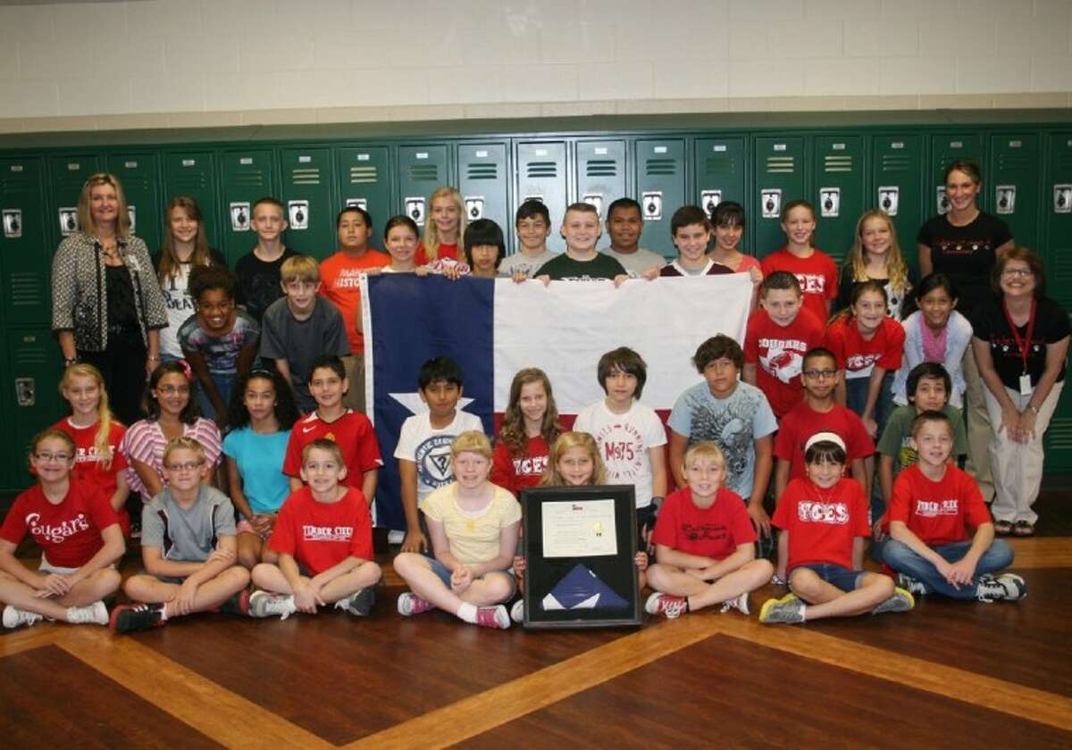 Students present Texas flag