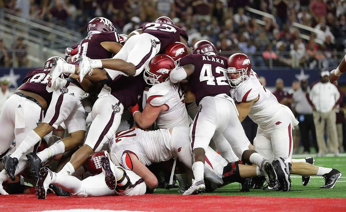 The Texas A&M defense makes a goal-line stand against the Arkansas Razorbacks in the third quarter at AT&T Stadium on Sept. 24, 2016 in Arlington.