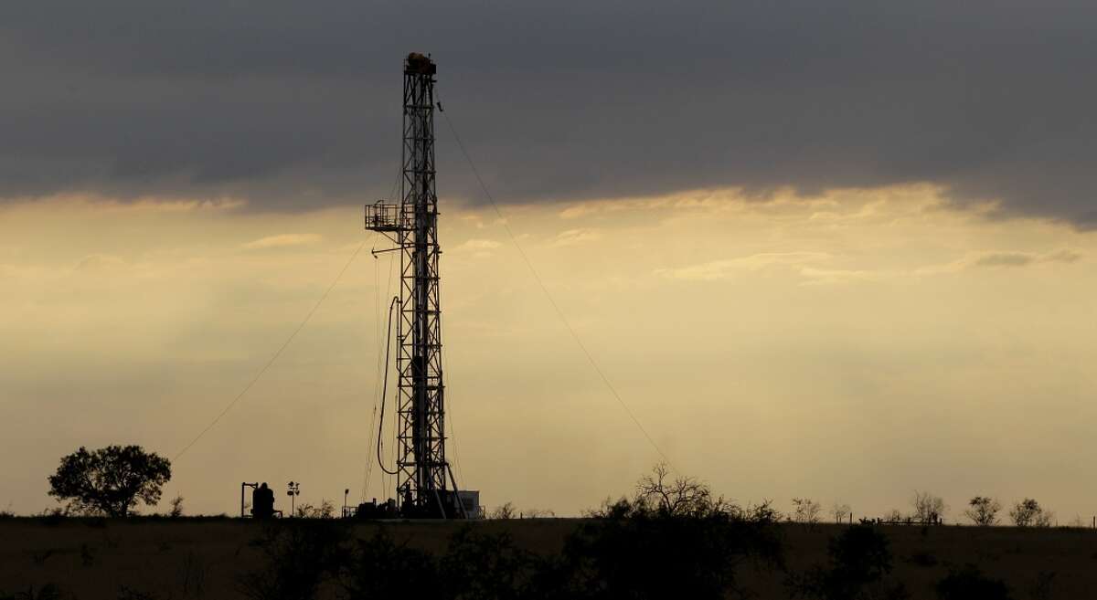 Take a by-the-numbers look at how the oil crash has shaken the Texas economy. A drilling rig is seen near Kennedy, Texas, Wednesday, May 9, 2012.