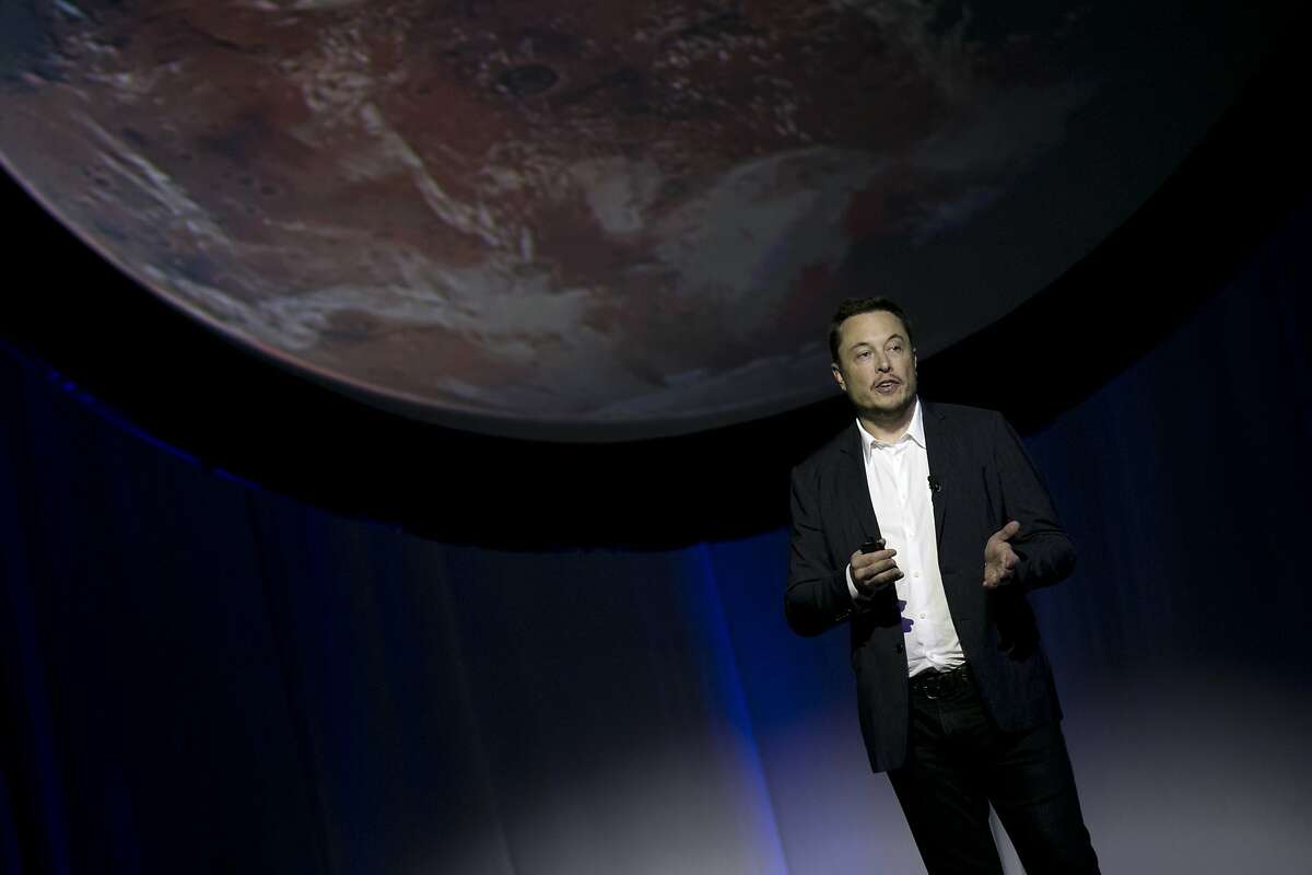 SpaceX founder Elon Musk speaks during the 67th International Astronautical Congress in Guadalajara, Mexico, Tuesday, Sept. 27, 2016. In a receptive audience full of space buffs, Musk said he envisions 1,000 passenger ships flying en masse to Mars, 'Battlestar Galactica' style. He calls it the Mars Colonial fleet, and he says it could become reality within a century. Musk's goal is to establish a full-fledged city on Mars and thereby make humans a multi-planetary species. (AP Photo/Refugio Ruiz)