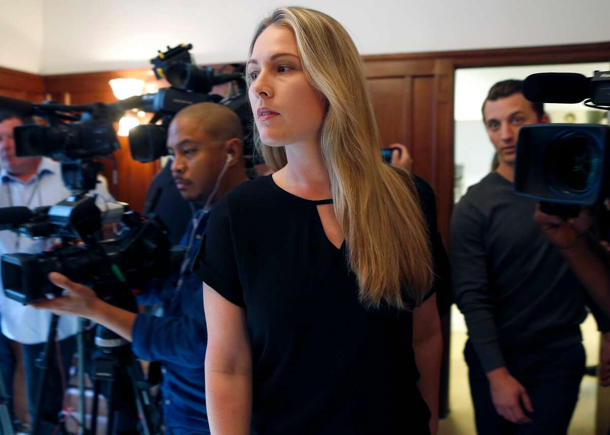 Denise Huskins and Aaron Quinn (right) walk into a news conference with attorney Doug Rappaport in San Francisco, Calif. on Thursday, Sept. 29, 2016. Huskins and Quinn were victims in the bizarre Vallejo kidnapping case in March 2015. Matthew Muller has pleaded guilty to kidnapping the couple.