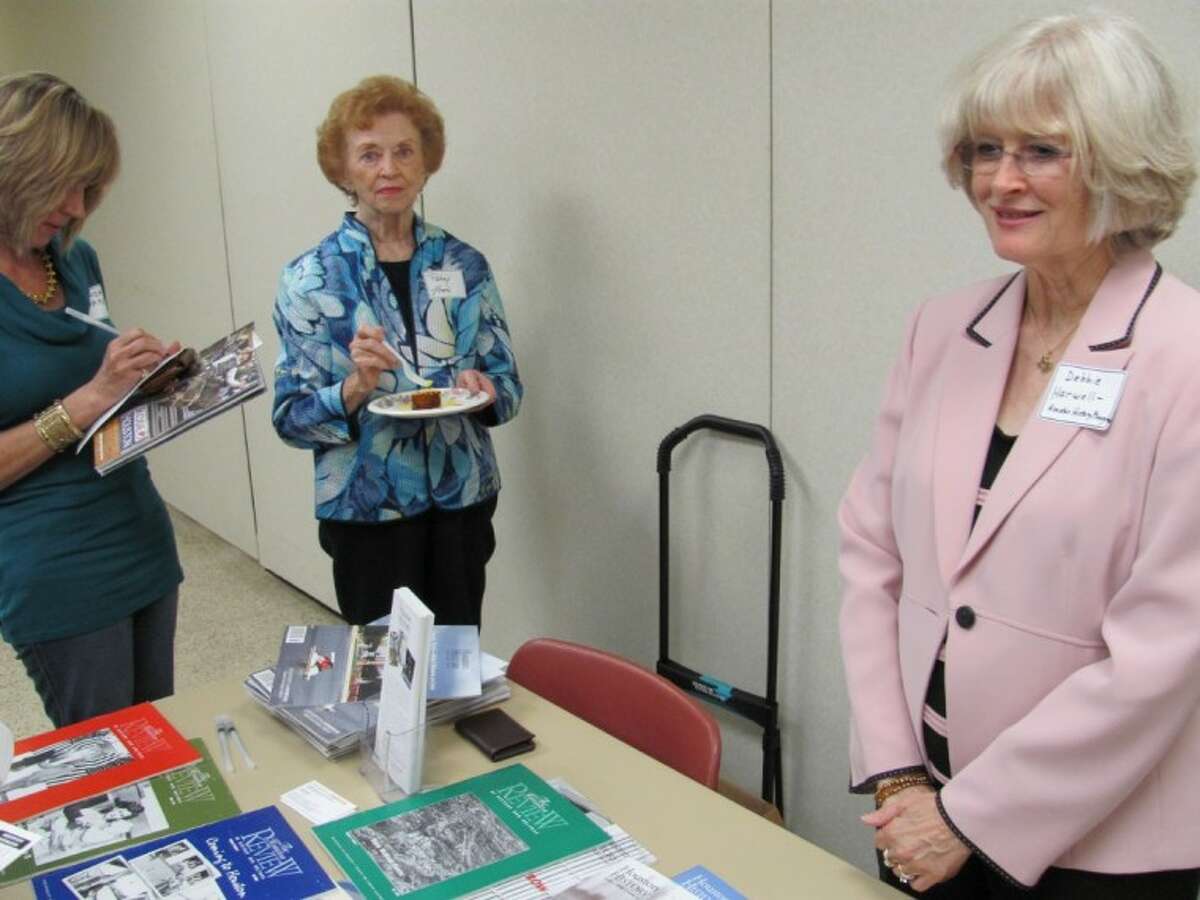From left, Linda Ware and Patsy Teas speak with Dr. Debbie Harwell about subscribing to “Houston History” magazine, which is published three times a year.